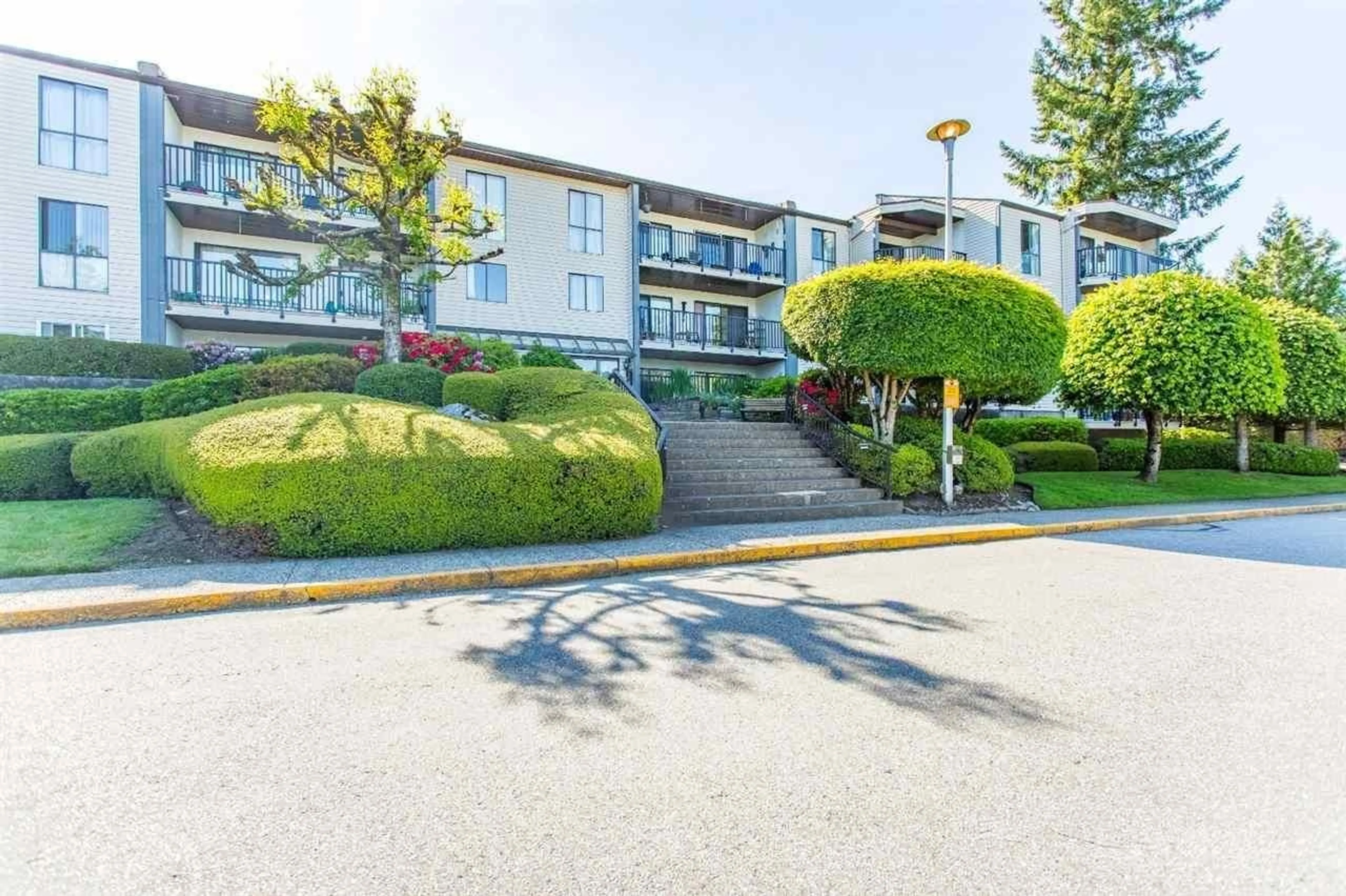 A pic from exterior of the house or condo, the street view for 305 9952 149 STREET, Surrey British Columbia V3R7W7