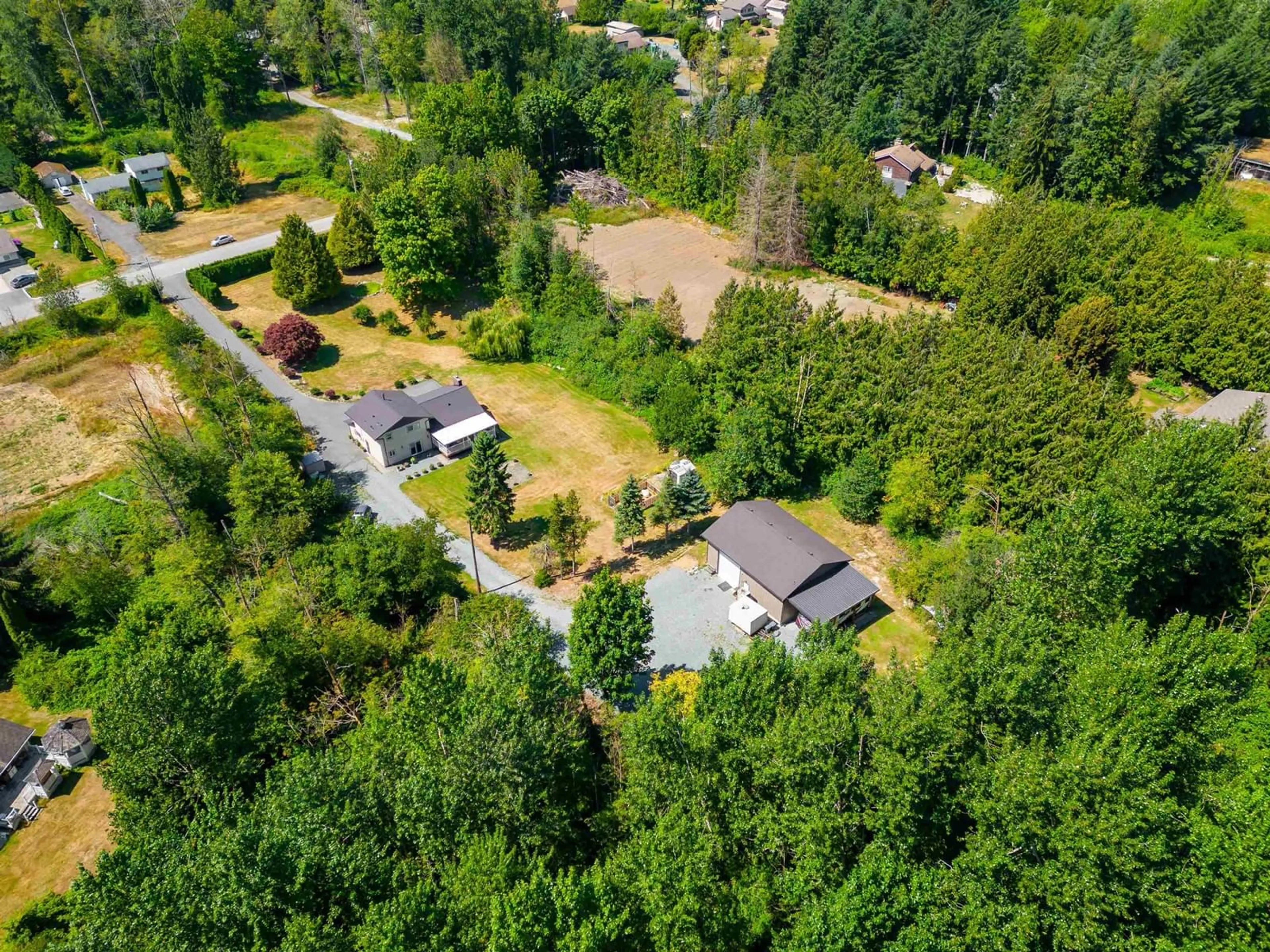 A pic from outside/outdoor area/front of a property/back of a property/a pic from drone, forest/trees view for 2482 267 STREET, Langley British Columbia V4W2Y3