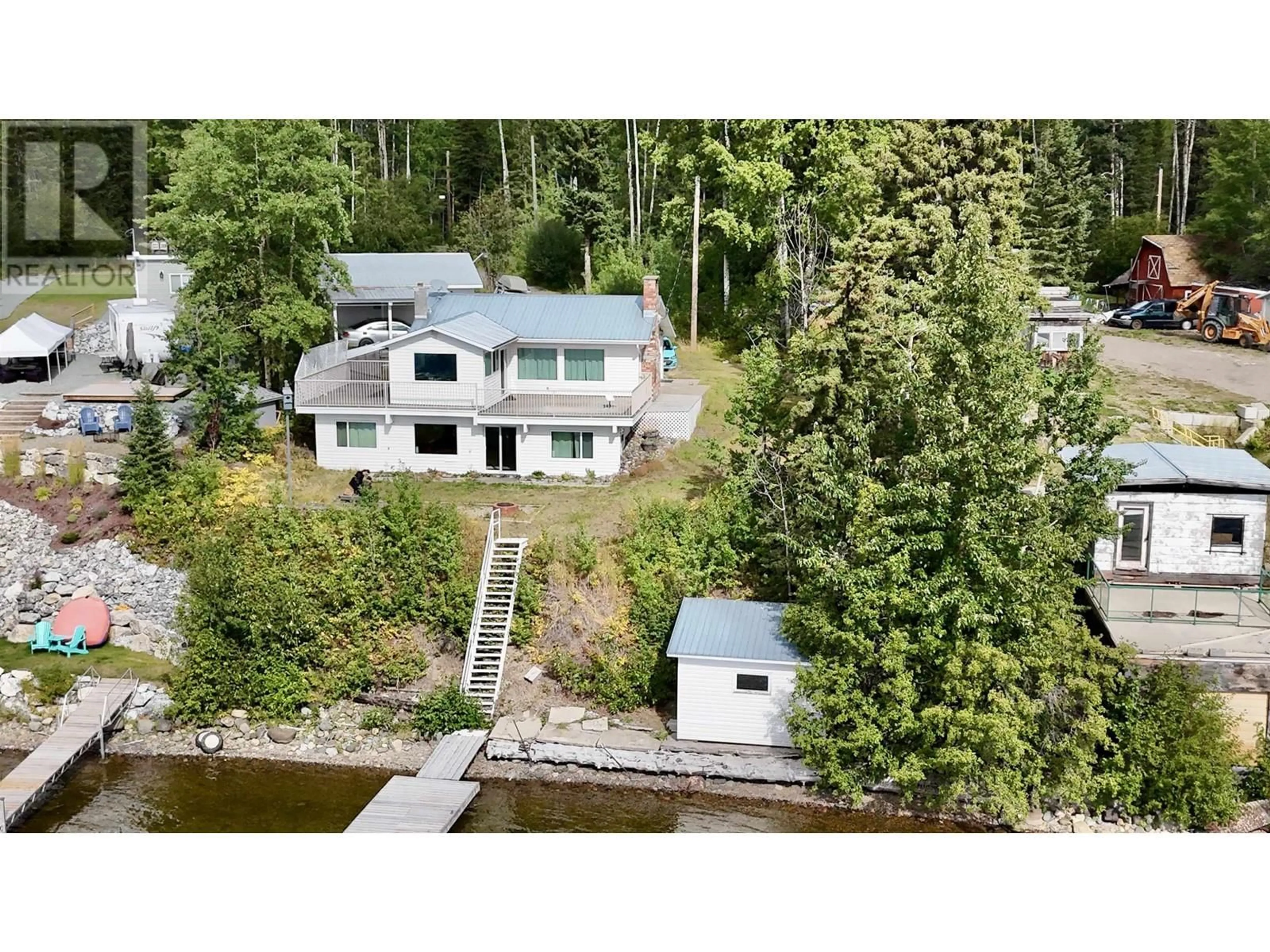 A pic from outside/outdoor area/front of a property/back of a property/a pic from drone, water/lake/river/ocean view for 54665 JARDINE ROAD, Cluculz Lake British Columbia V0J3A3