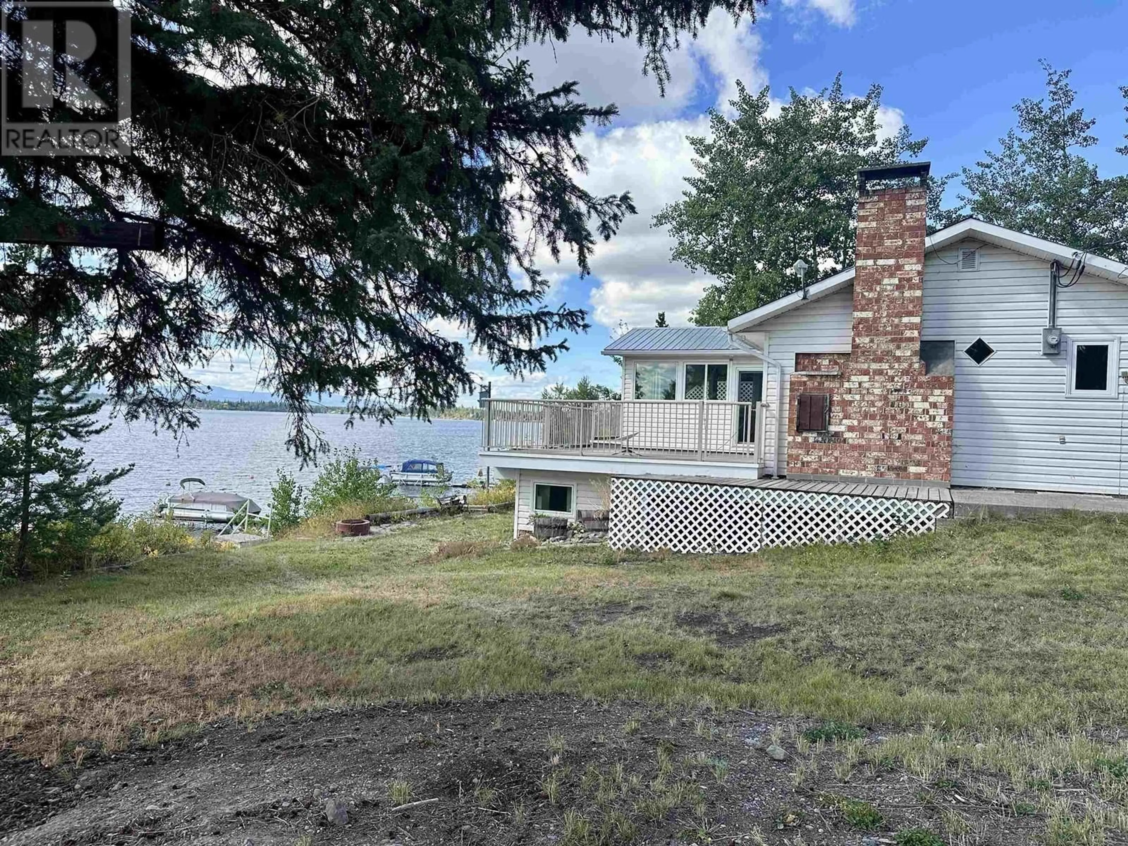 A pic from outside/outdoor area/front of a property/back of a property/a pic from drone, water/lake/river/ocean view for 54665 JARDINE ROAD, Cluculz Lake British Columbia V0J3A3