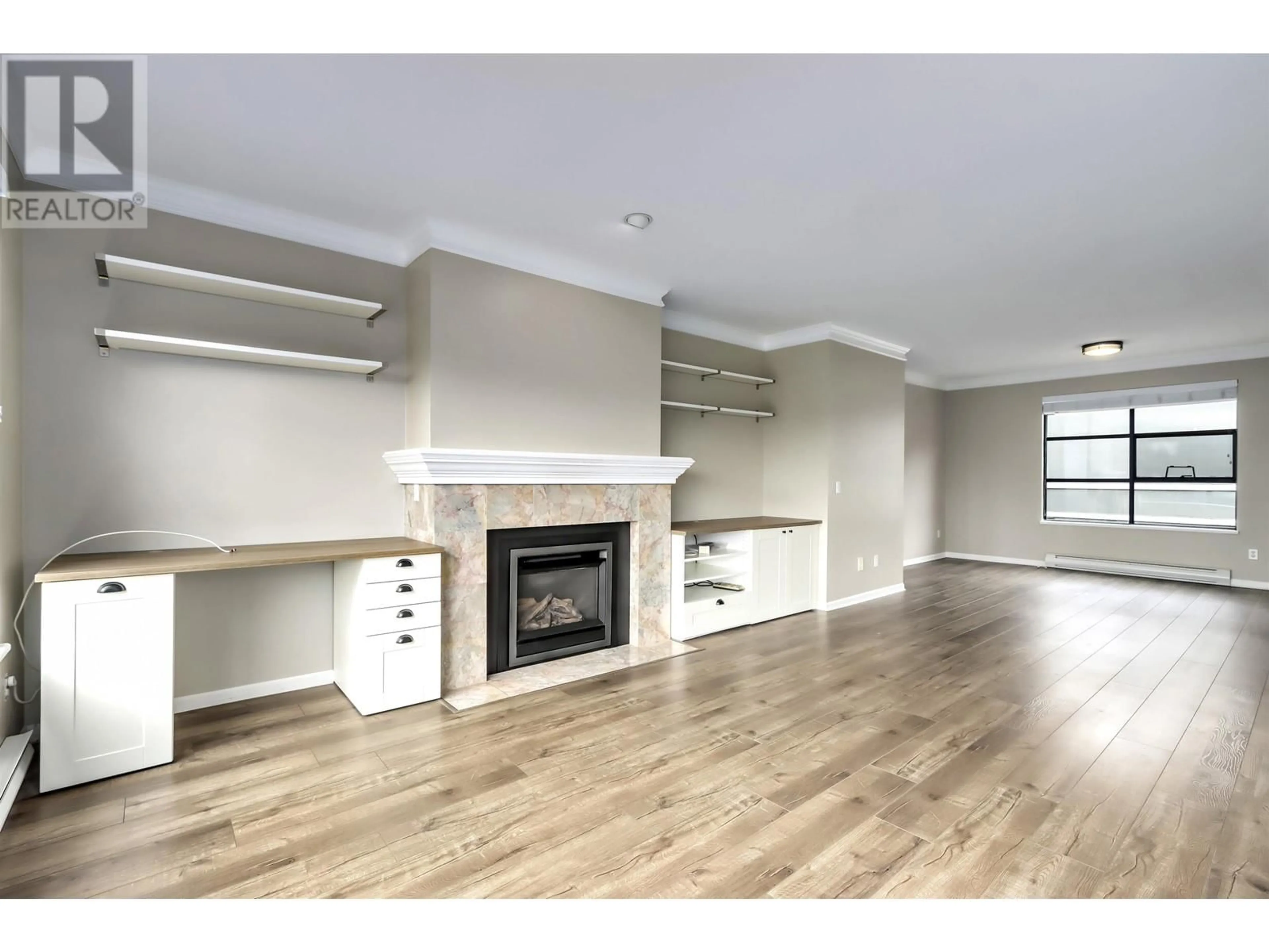 Living room, wood floors for 301 3151 WOODBINE DRIVE, North Vancouver British Columbia V7R2S4