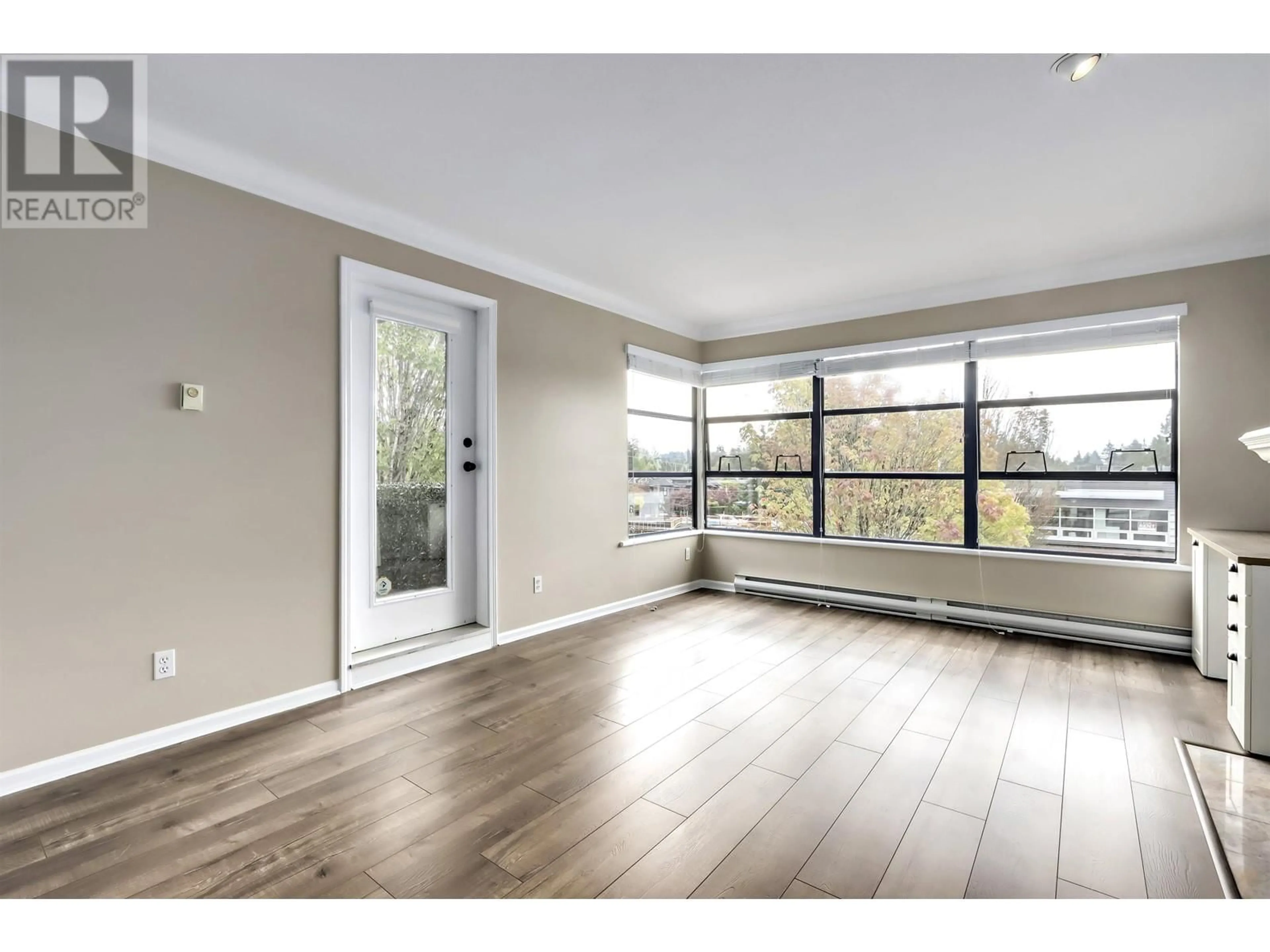 A pic of a room, wood floors for 301 3151 WOODBINE DRIVE, North Vancouver British Columbia V7R2S4