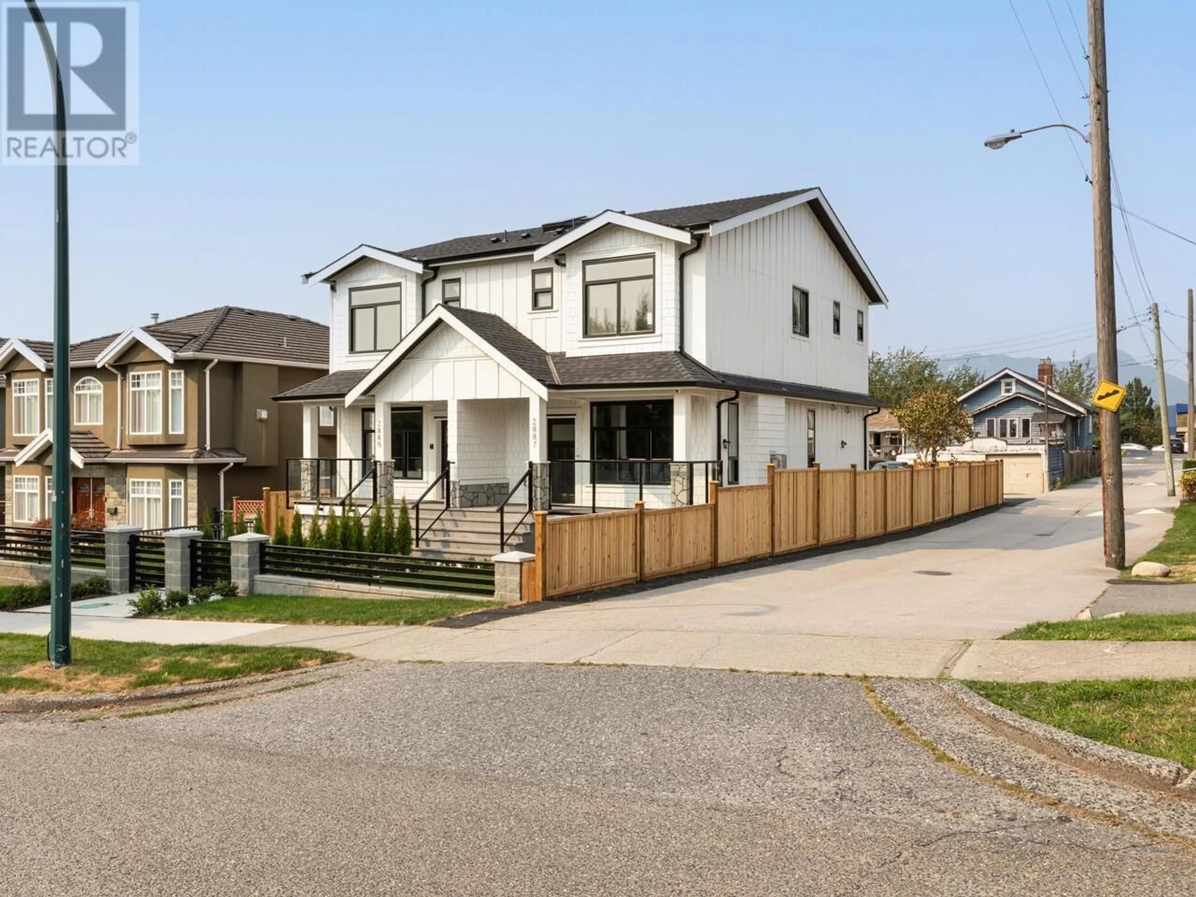 Frontside or backside of a home, the fenced backyard for 2887 E 3RD AVENUE, Vancouver British Columbia V5M1H5