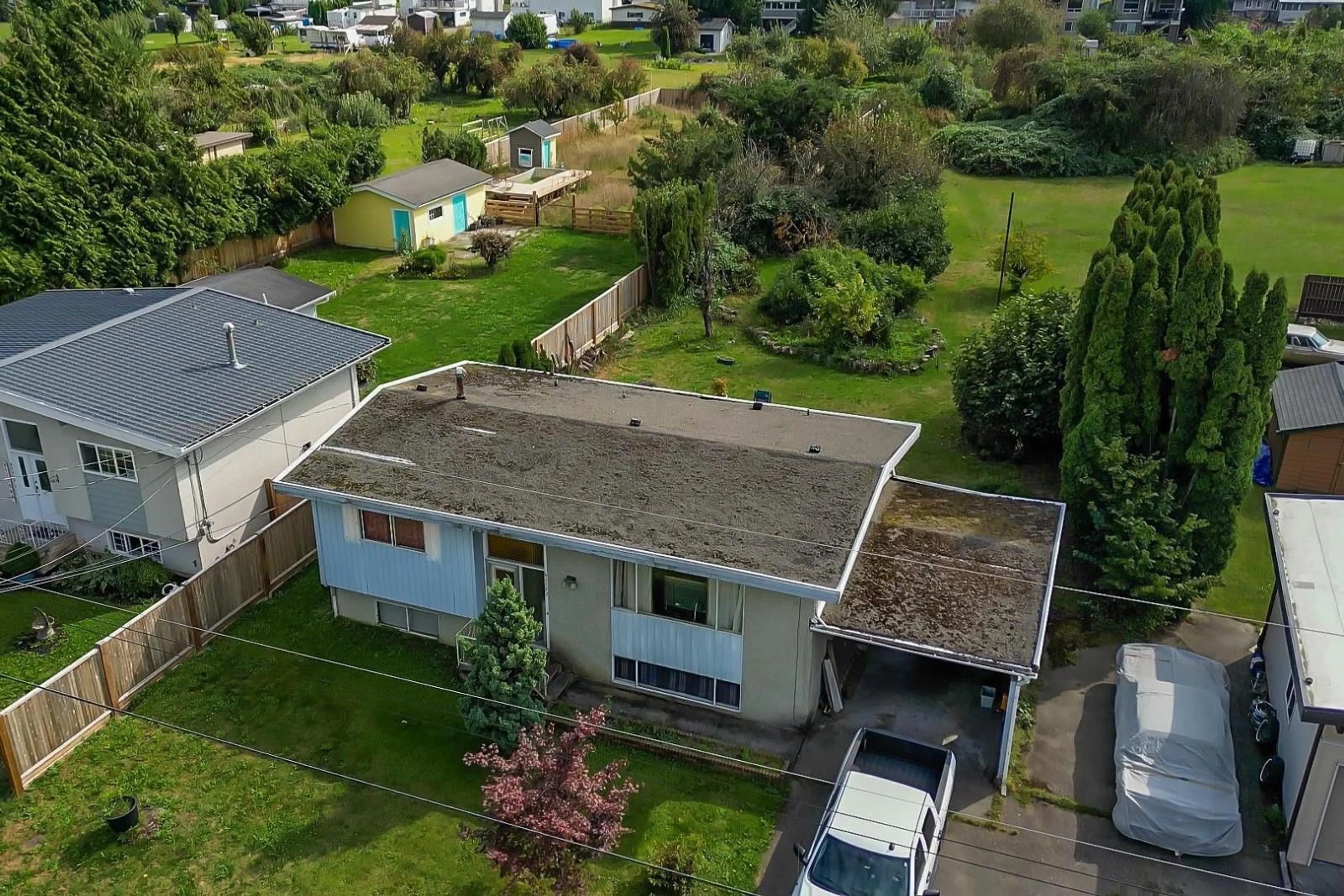 Frontside or backside of a home, the fenced backyard for 45122 BALMORAL AVENUE, Chilliwack British Columbia V2R3G8