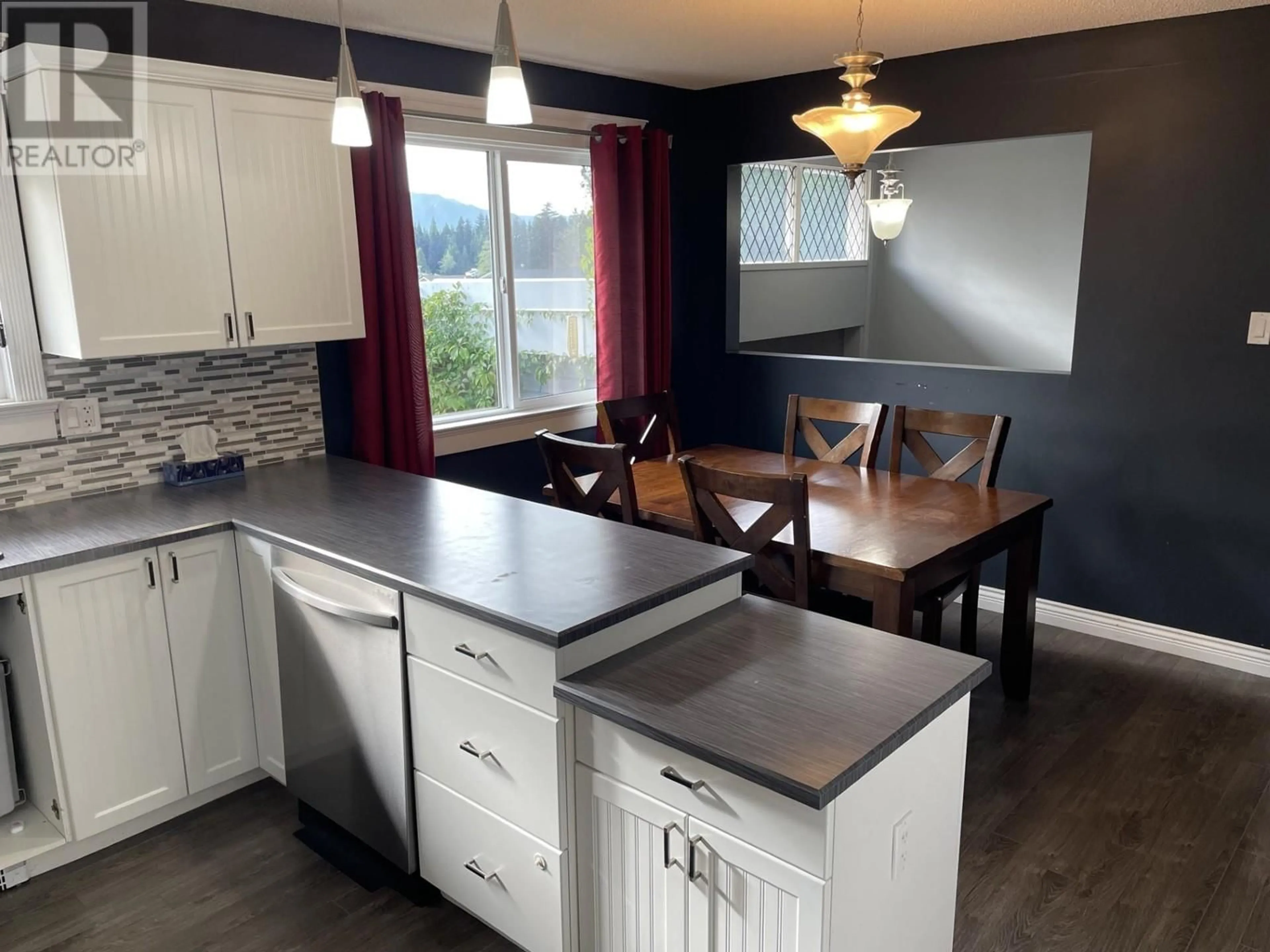 Open concept kitchen, wood/laminate floor for 20 DAVY CRESCENT, Kitimat British Columbia V8C1C5