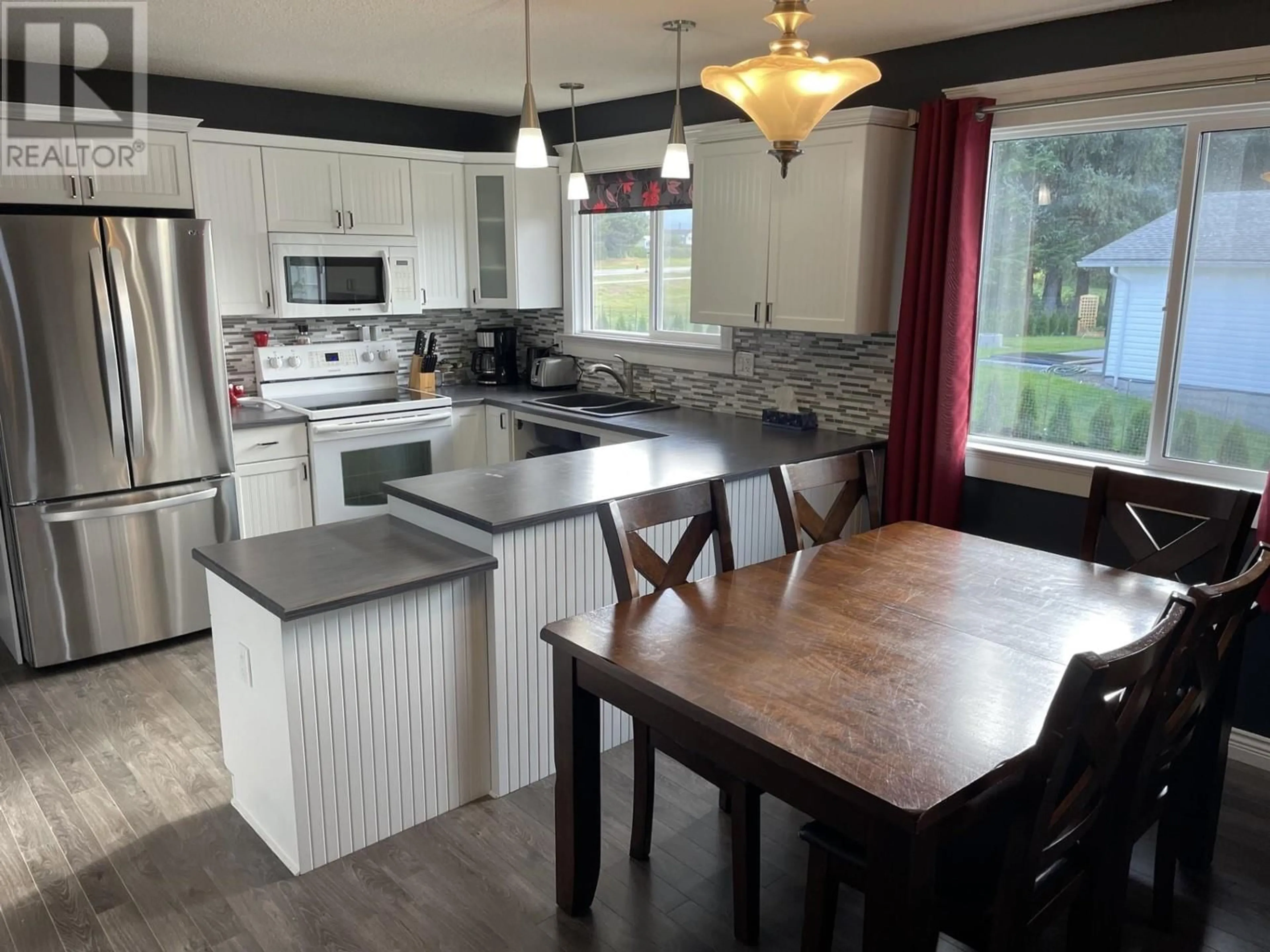 Open concept kitchen, wood/laminate floor for 20 DAVY CRESCENT, Kitimat British Columbia V8C1C5