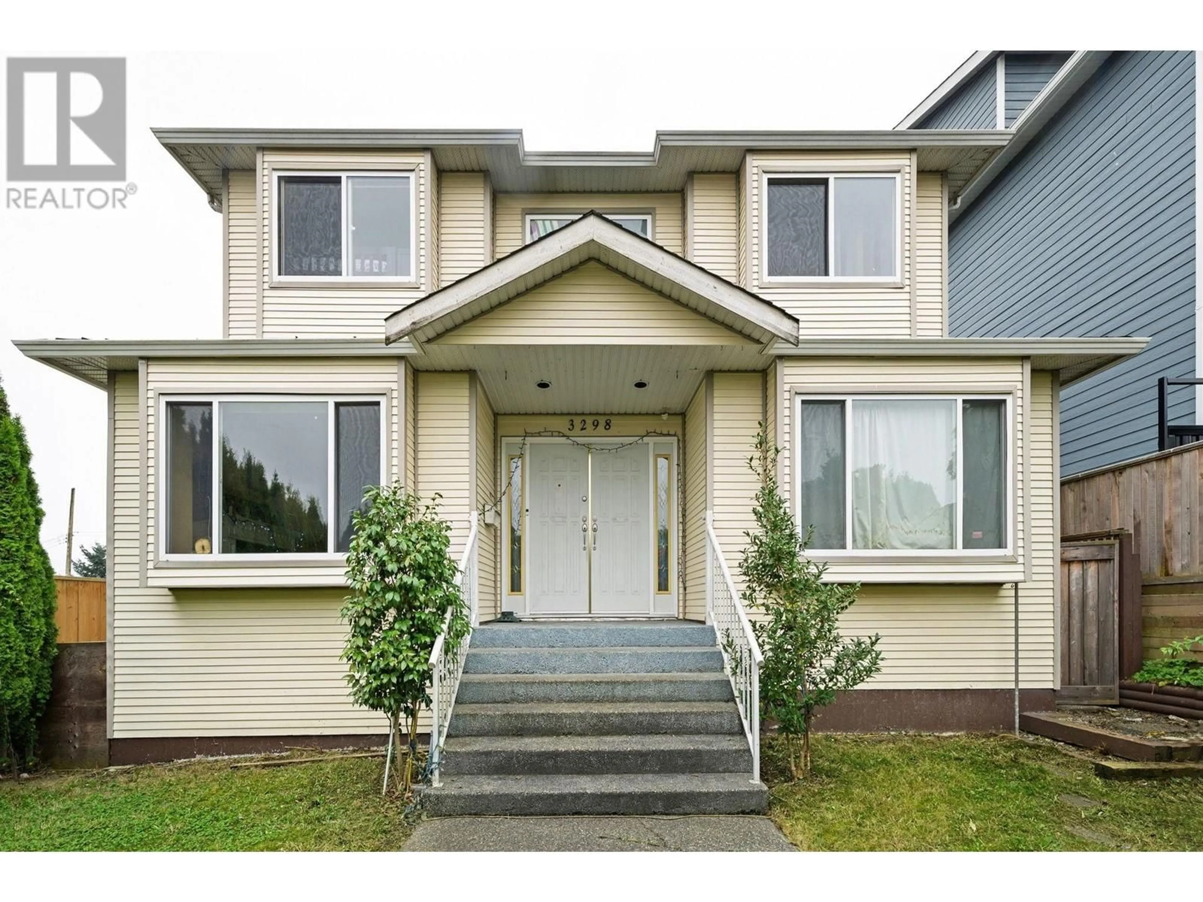 Frontside or backside of a home, the front or back of building for 3298 E 2ND AVENUE, Vancouver British Columbia V5M1G3