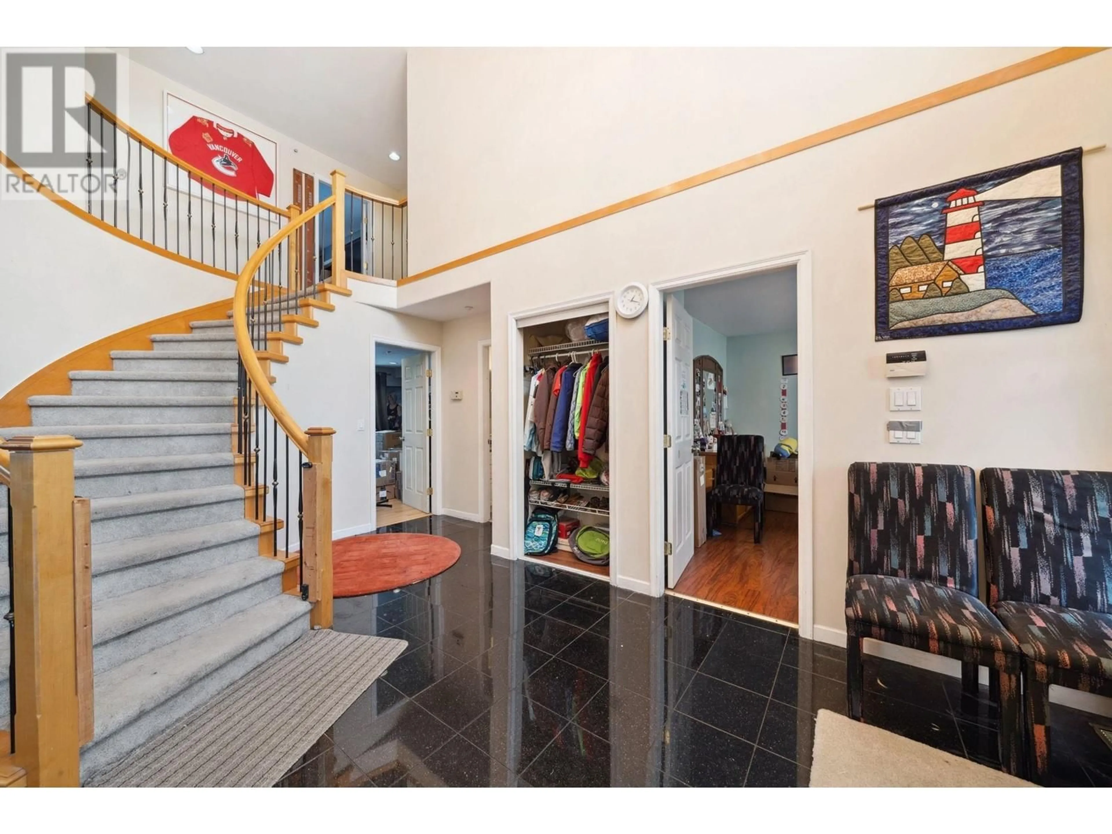 Indoor foyer, wood floors for 3298 E 2ND AVENUE, Vancouver British Columbia V5M1G3