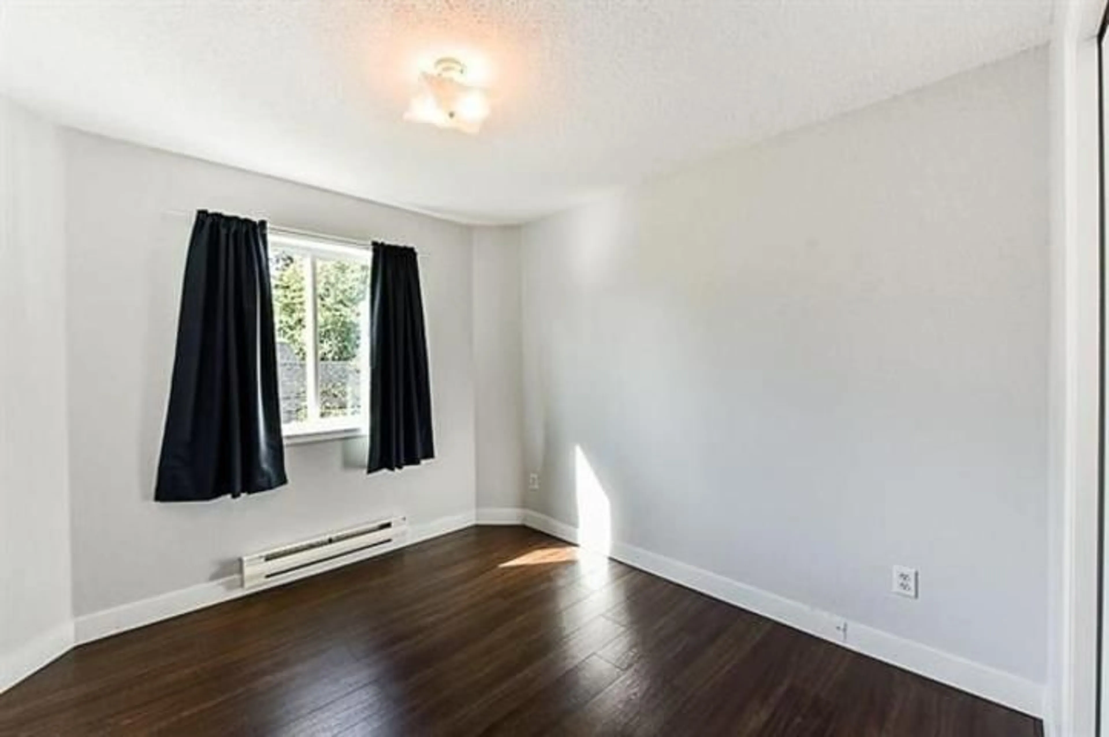 A pic of a room, wood floors for 8 46160 PRINCESS AVENUE, Chilliwack British Columbia V2P2A7