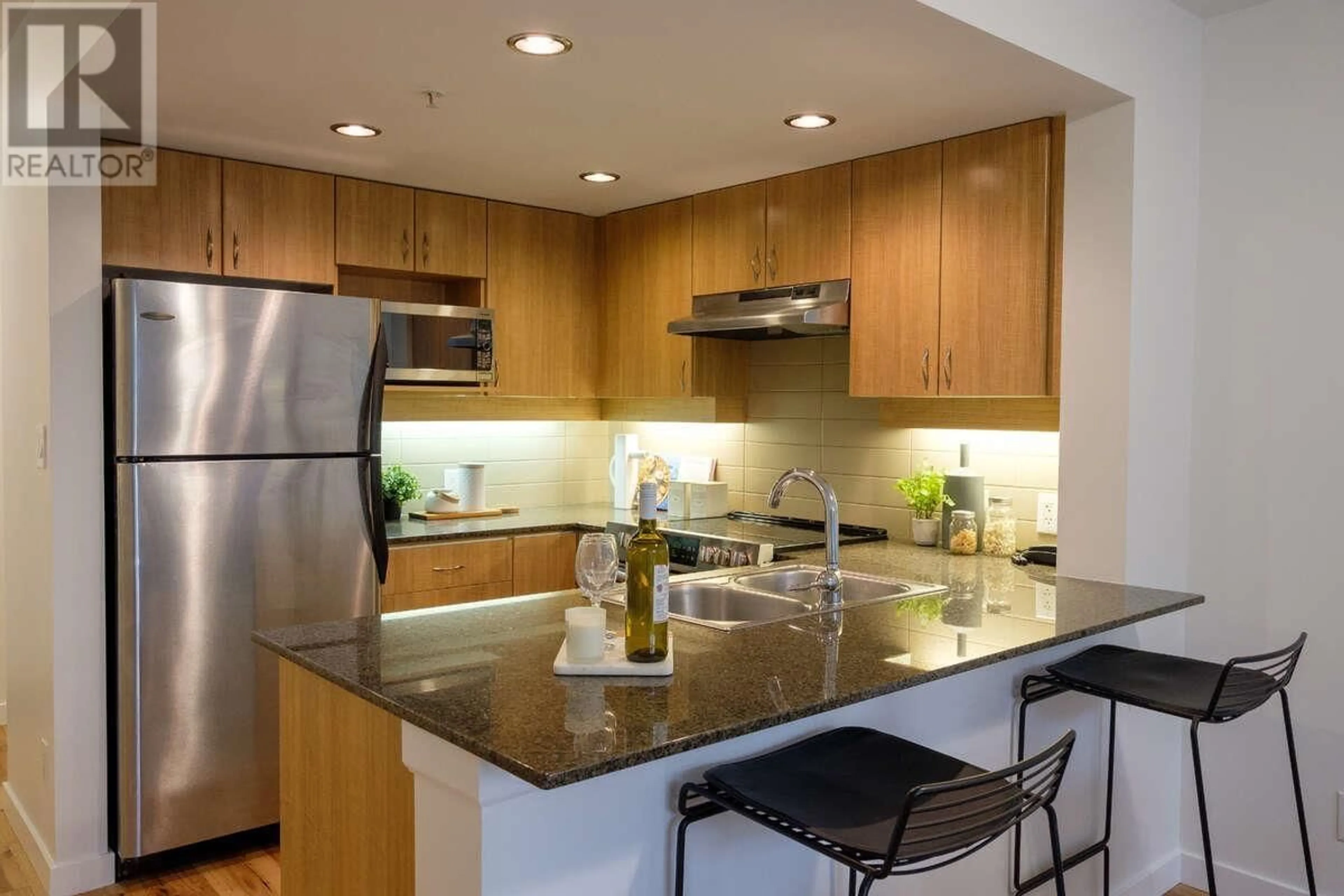 Contemporary kitchen, wood floors for 403 9232 UNIVERSITY CRESCENT, Burnaby British Columbia V5A0A3