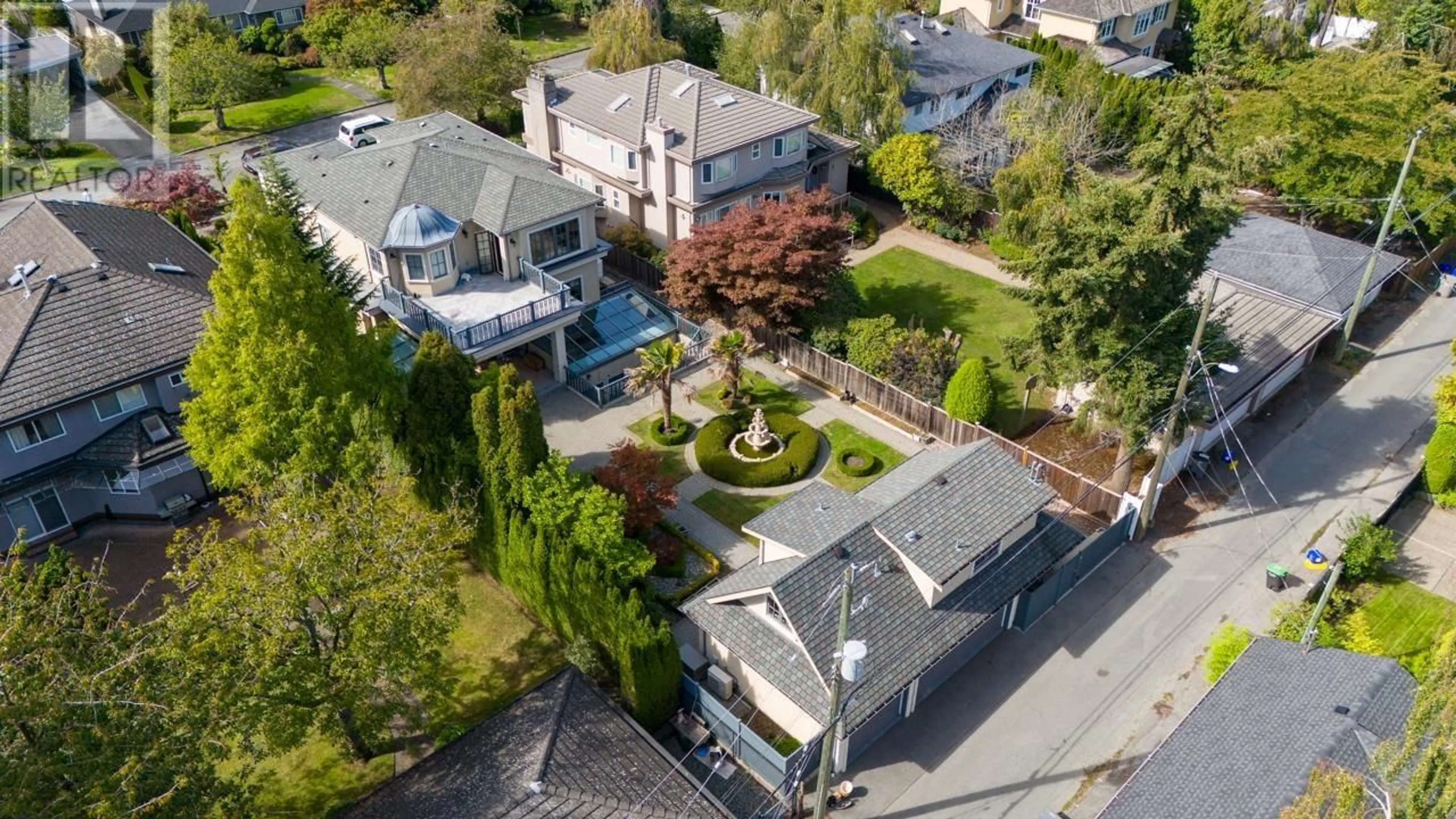 Frontside or backside of a home, the fenced backyard for 7216 BEECHWOOD STREET, Vancouver British Columbia V6P5V4