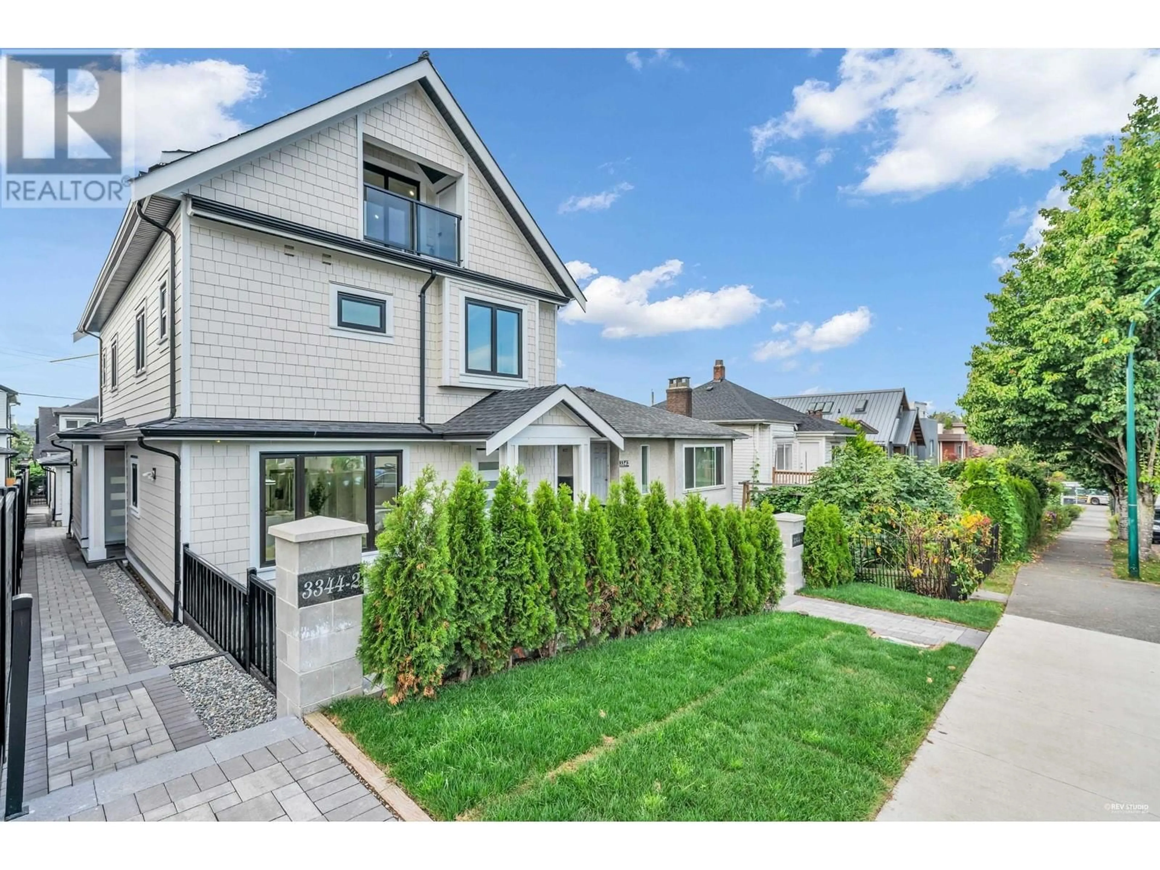 Frontside or backside of a home, the fenced backyard for 2 3344 ADANAC STREET, Vancouver British Columbia V5K2P3