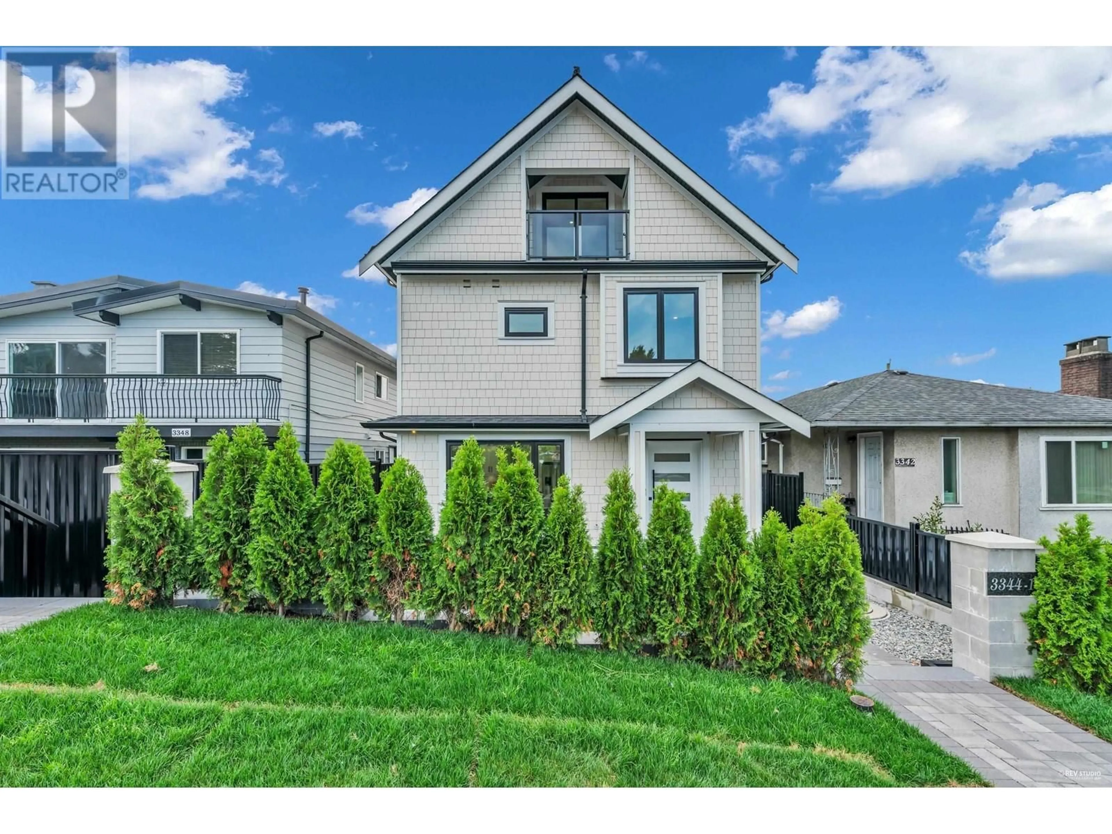 Frontside or backside of a home, the fenced backyard for 1 3344 ADANAC STREET, Vancouver British Columbia V5K2P3