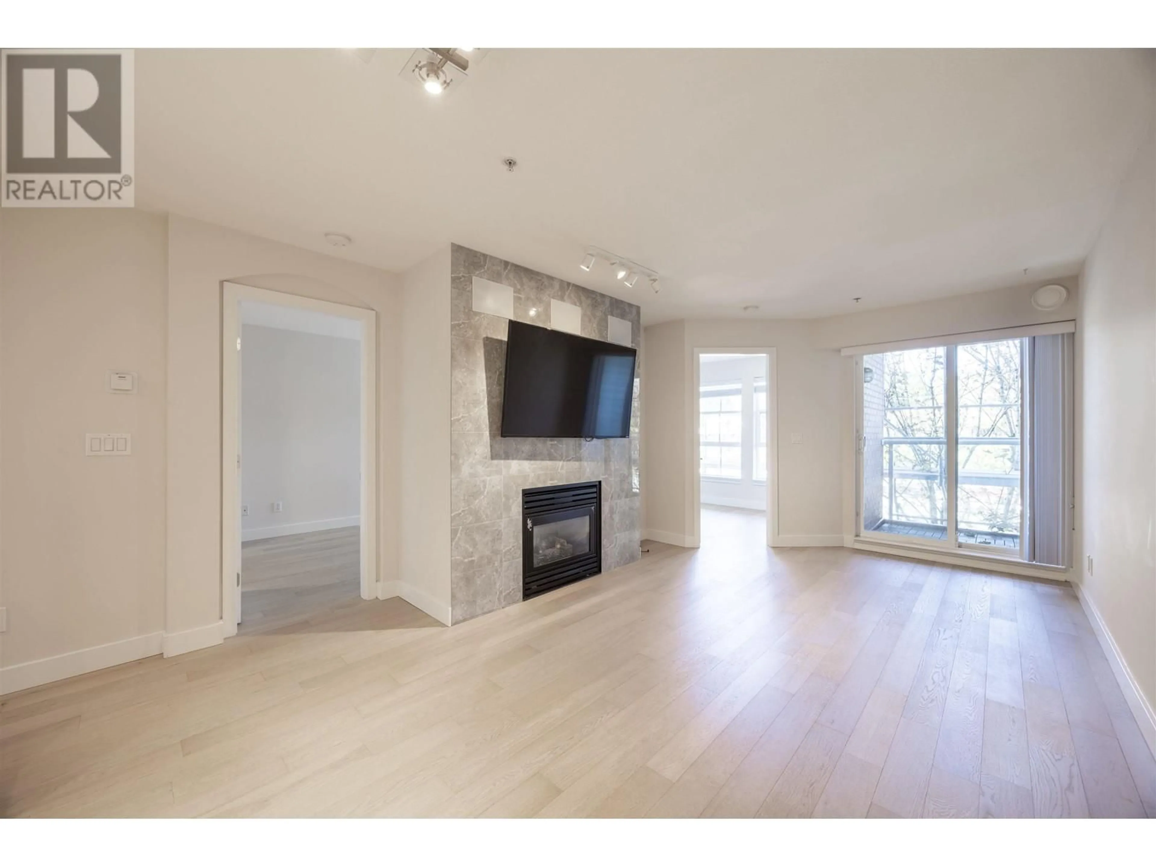 Living room, wood floors for 310 5723 COLLINGWOOD STREET, Vancouver British Columbia V6N4K6