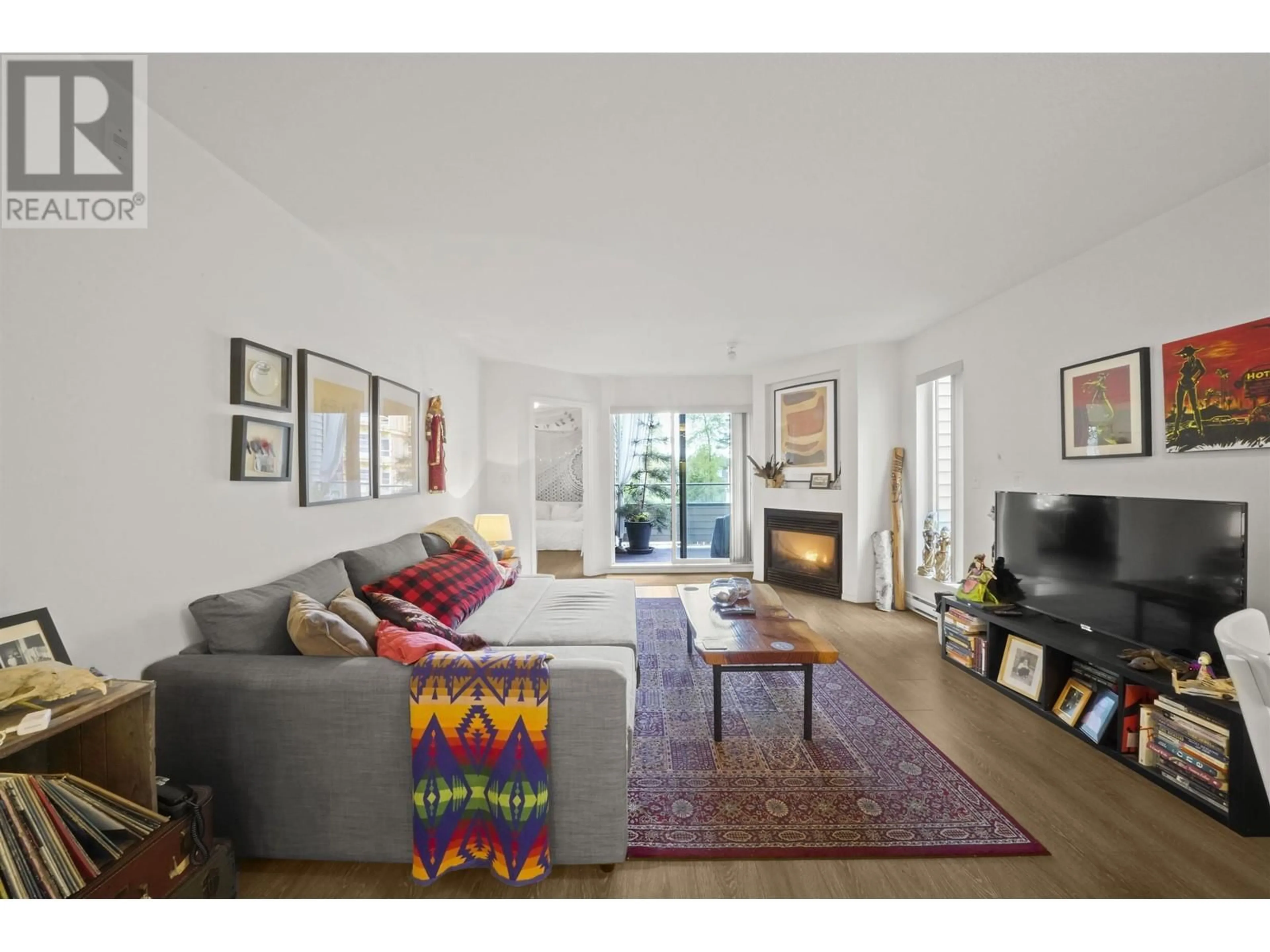 Living room, carpet floors for 209 2915 GLEN DRIVE, Coquitlam British Columbia V3B7H8