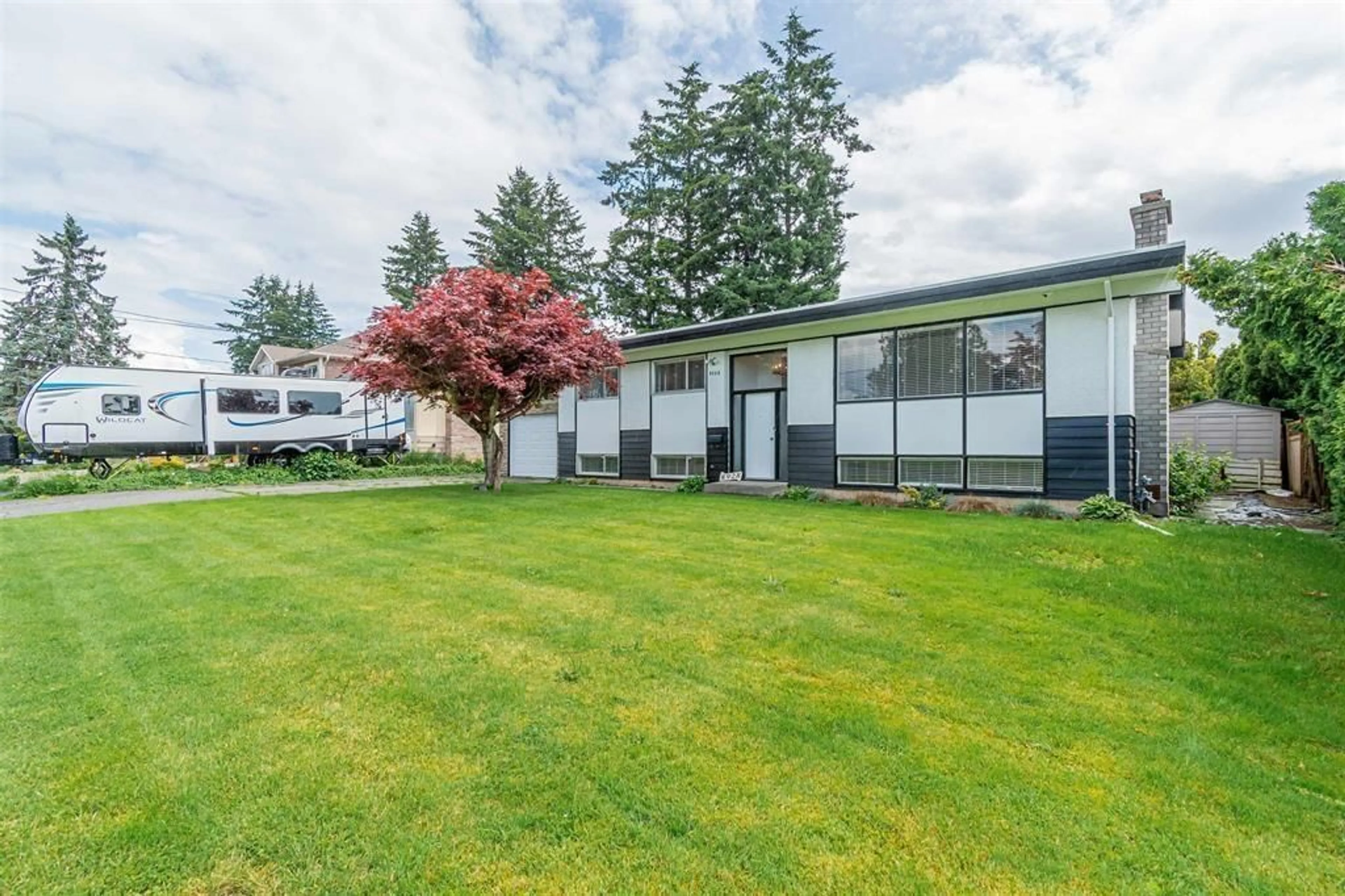 Frontside or backside of a home, the fenced backyard for 8928 GLENWOOD STREET, Chilliwack British Columbia V2P3Z6