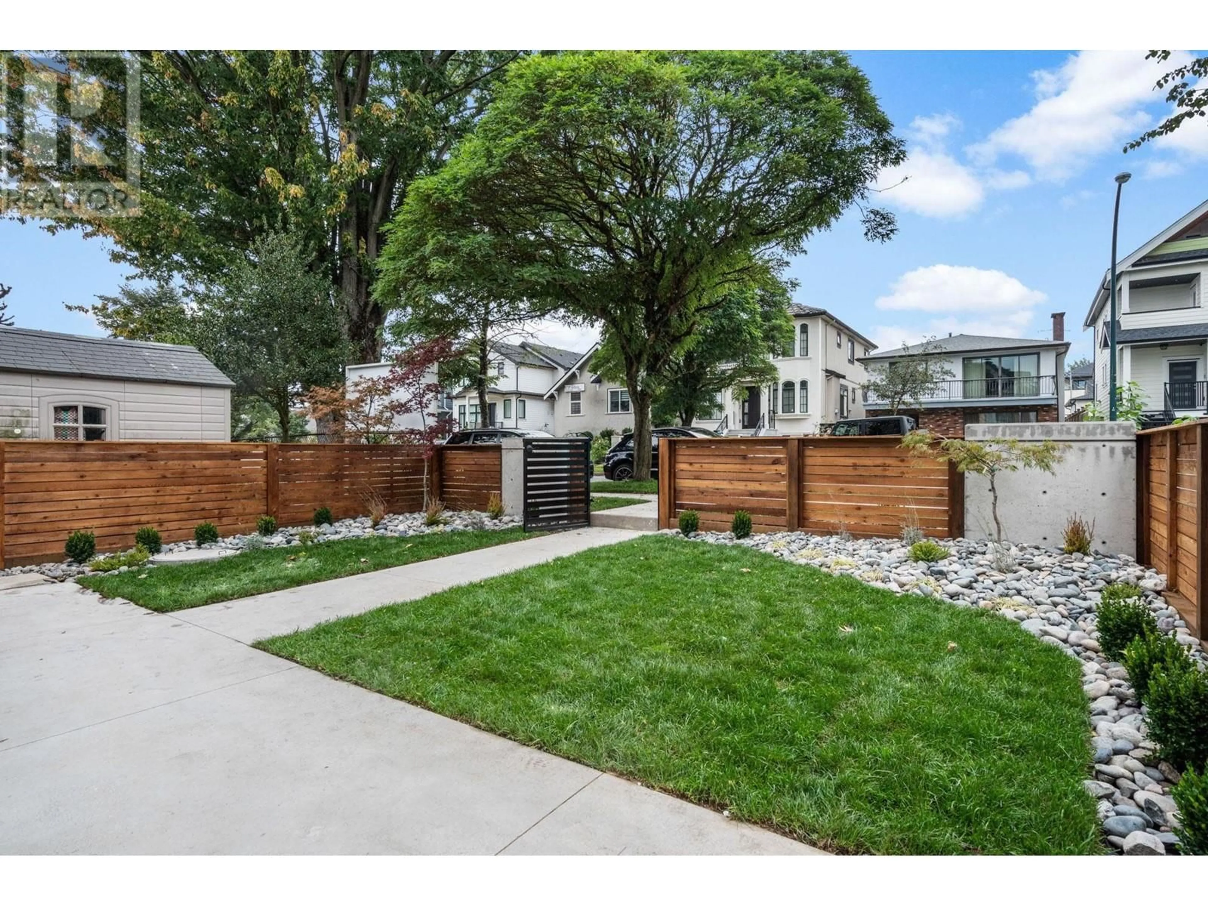 Frontside or backside of a home, the fenced backyard for 1 3494 FRANKLIN STREET, Vancouver British Columbia V5K1Y3