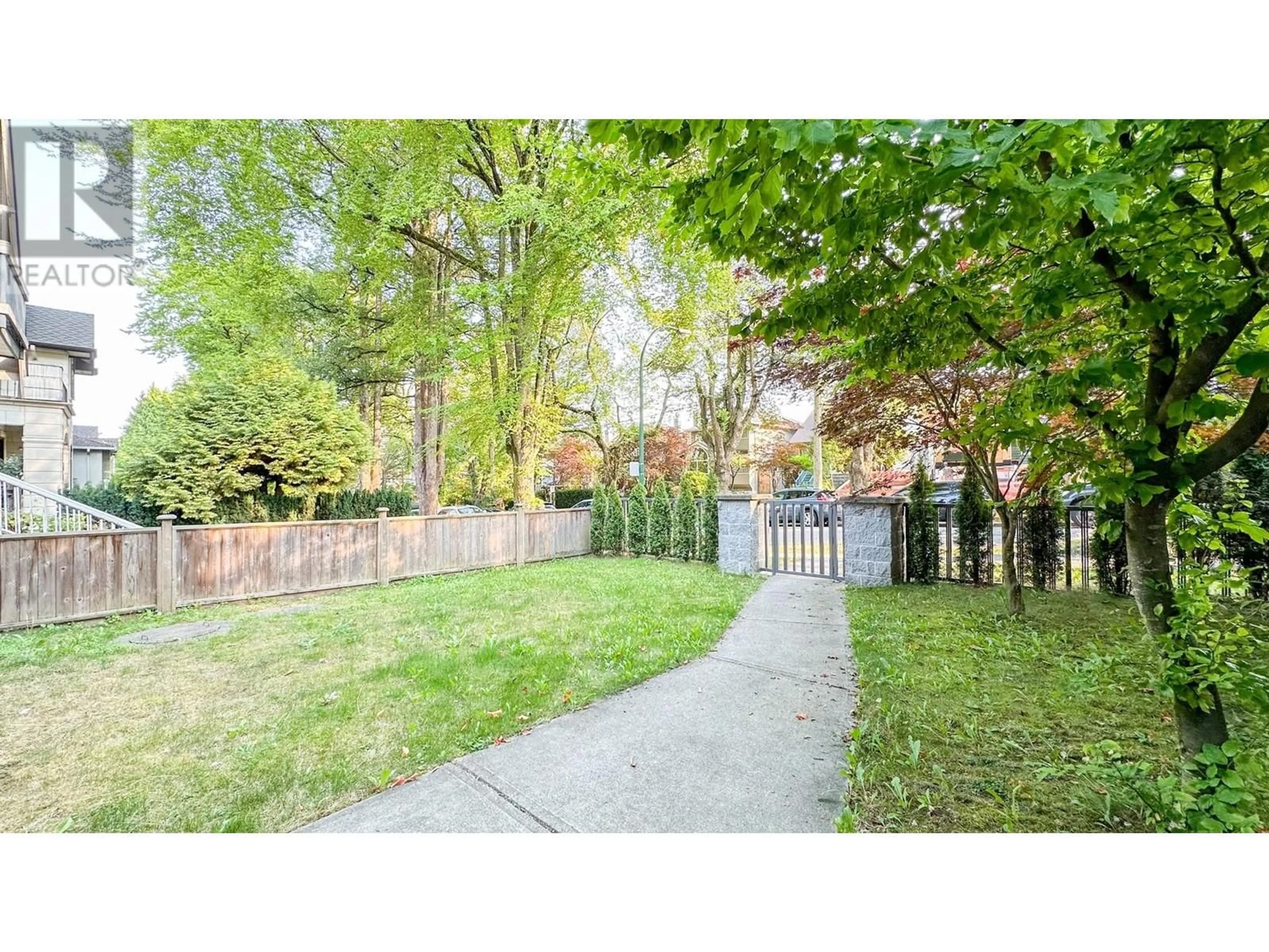 Frontside or backside of a home, the fenced backyard for 975 W 23RD AVENUE, Vancouver British Columbia V5Z2B2