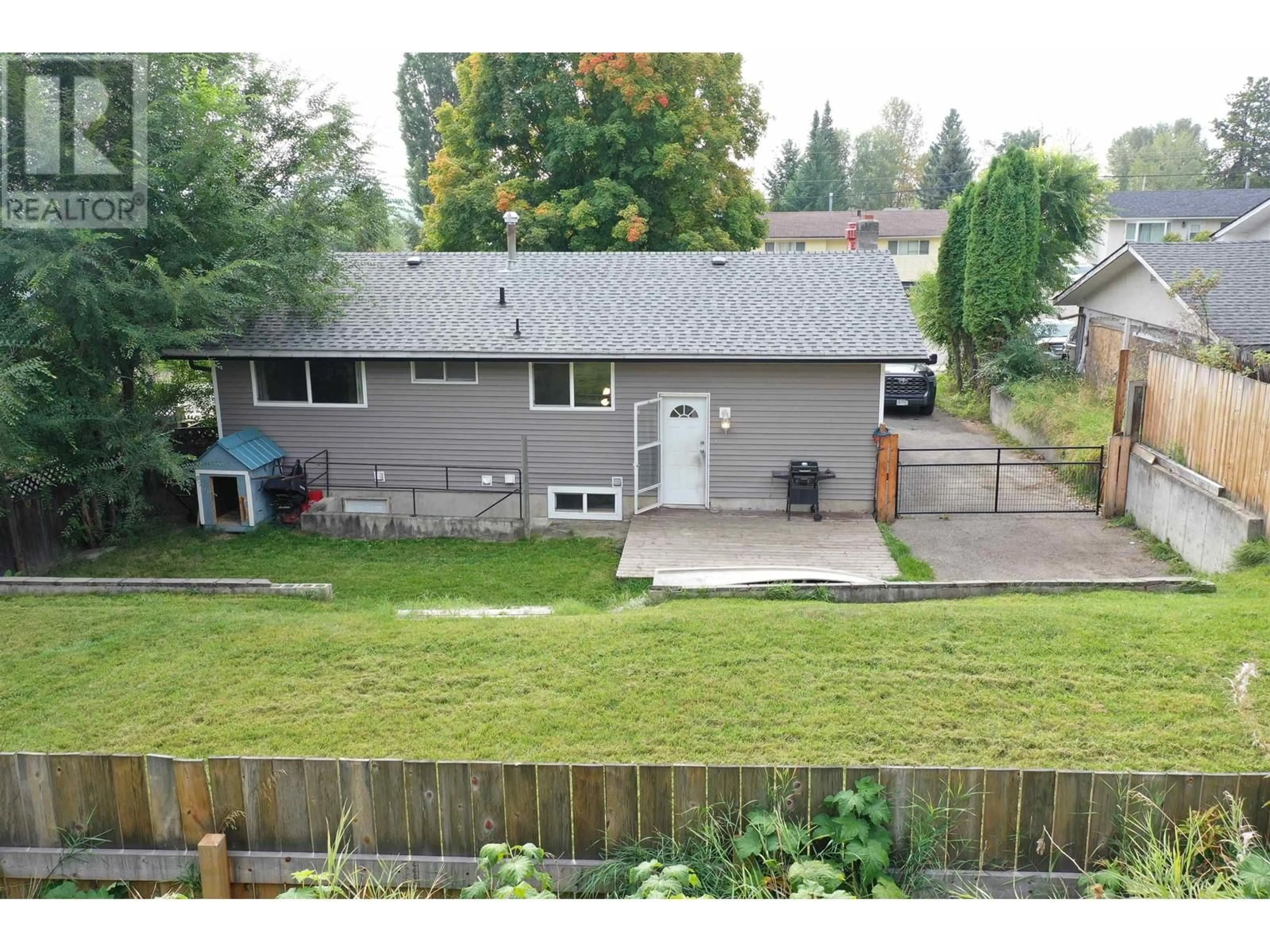 Frontside or backside of a home, the fenced backyard for 1385 LEWIS DRIVE, Quesnel British Columbia V2J1K9