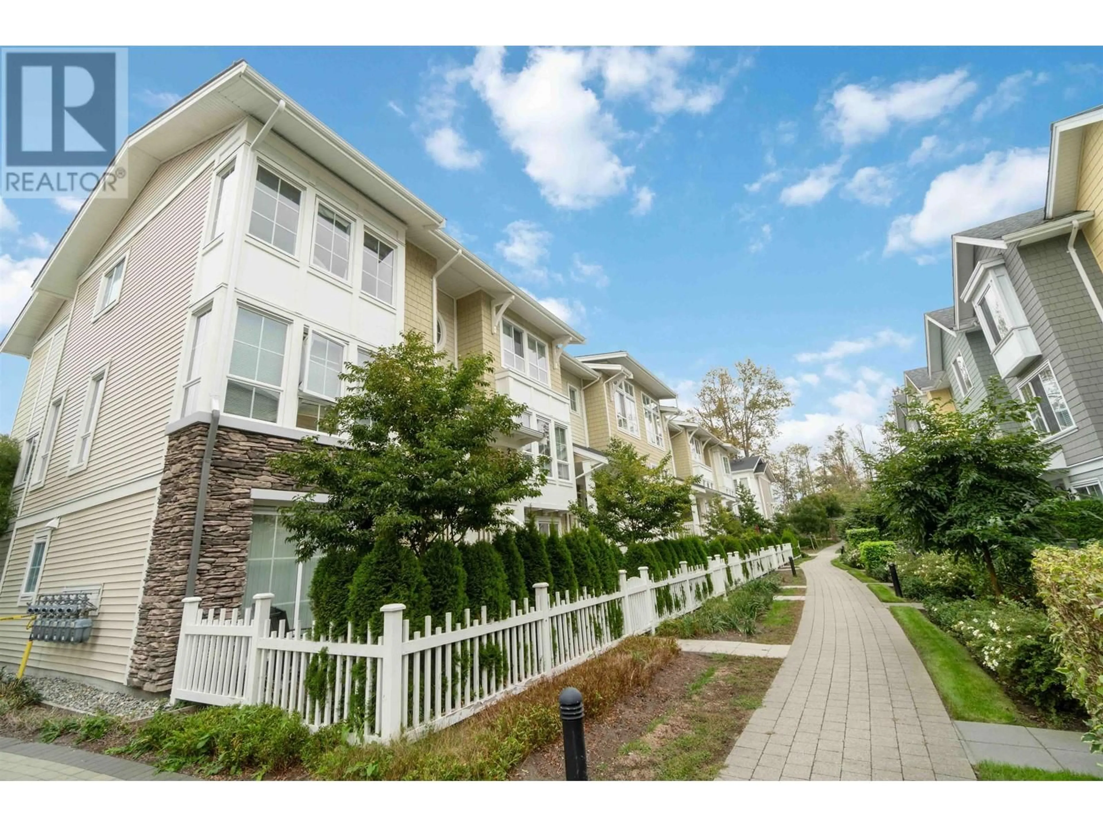 A pic from exterior of the house or condo, the street view for 52 5551 ADMIRAL WAY, Delta British Columbia V4K0C9