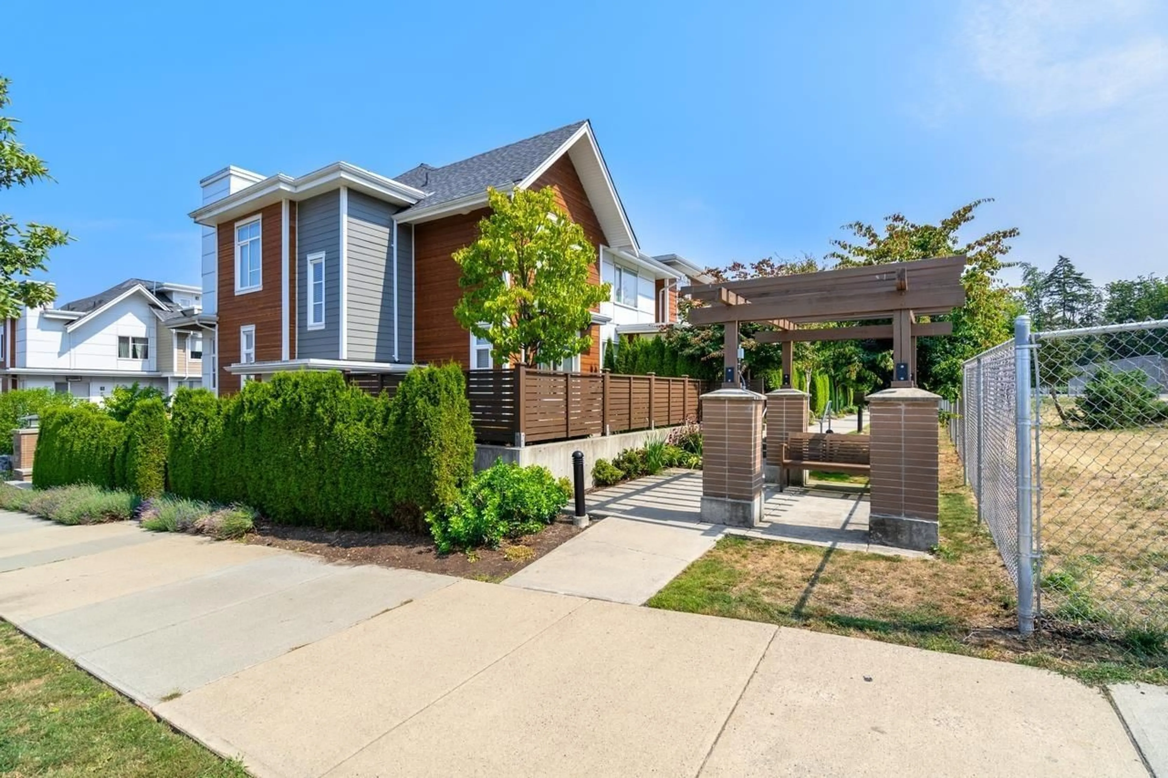 A pic from exterior of the house or condo, the fenced backyard for 3 2958 159 STREET, Surrey British Columbia V3Z0R1