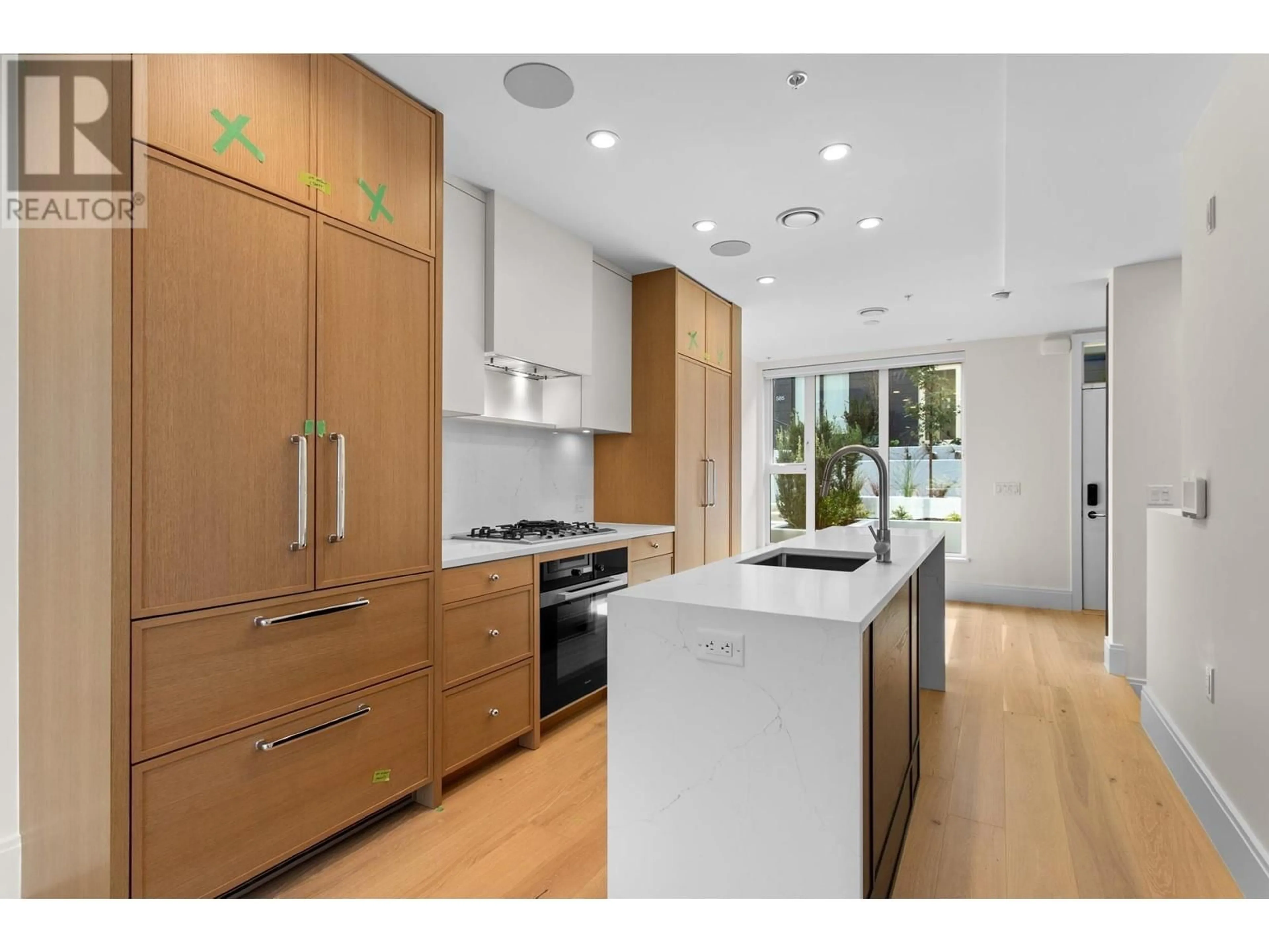 Contemporary kitchen, wood floors for 577 W 26TH AVENUE, Vancouver British Columbia V5Z2E4