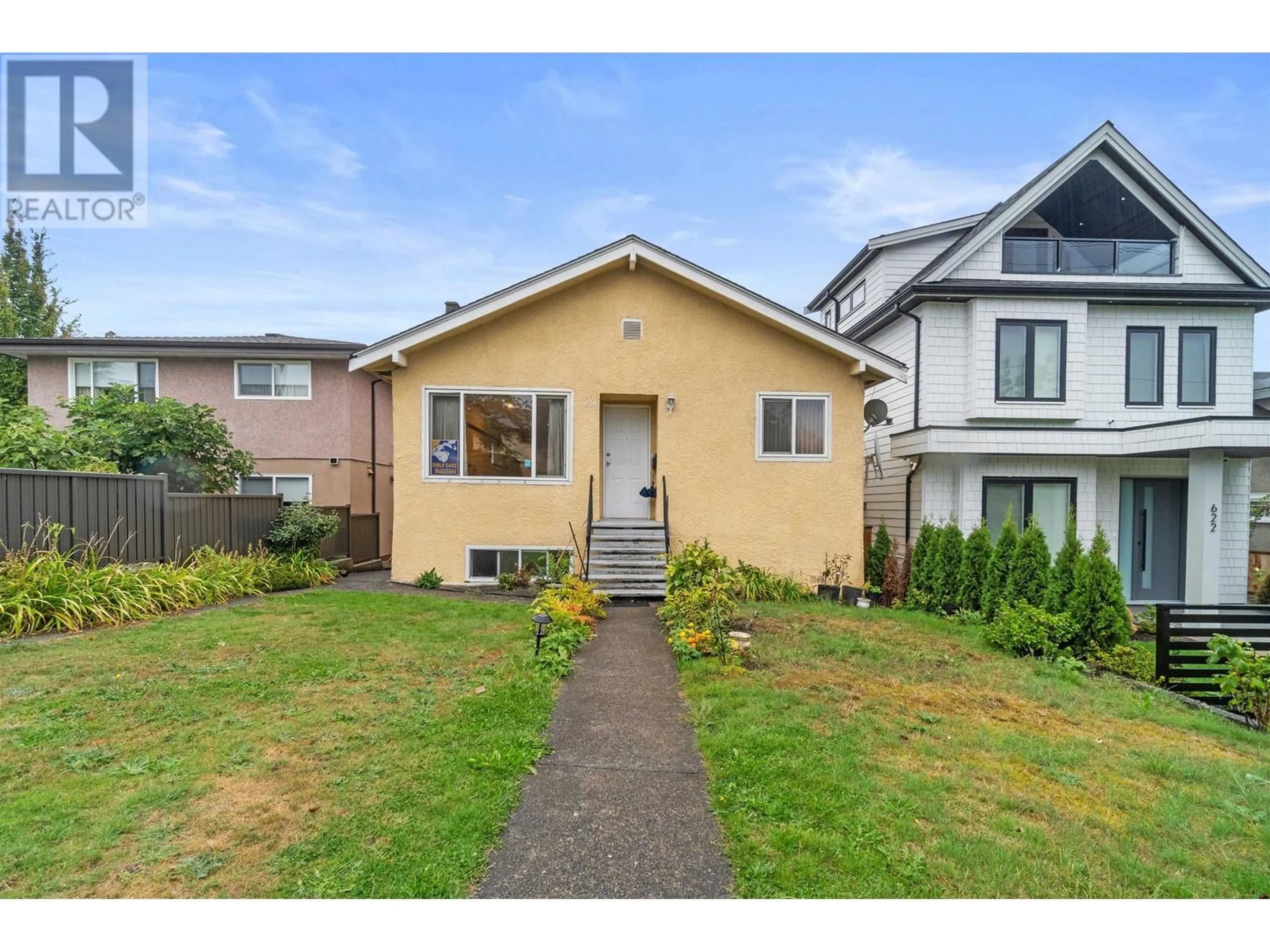 Frontside or backside of a home, the fenced backyard for 620 SLOCAN STREET, Vancouver British Columbia V5K3X7