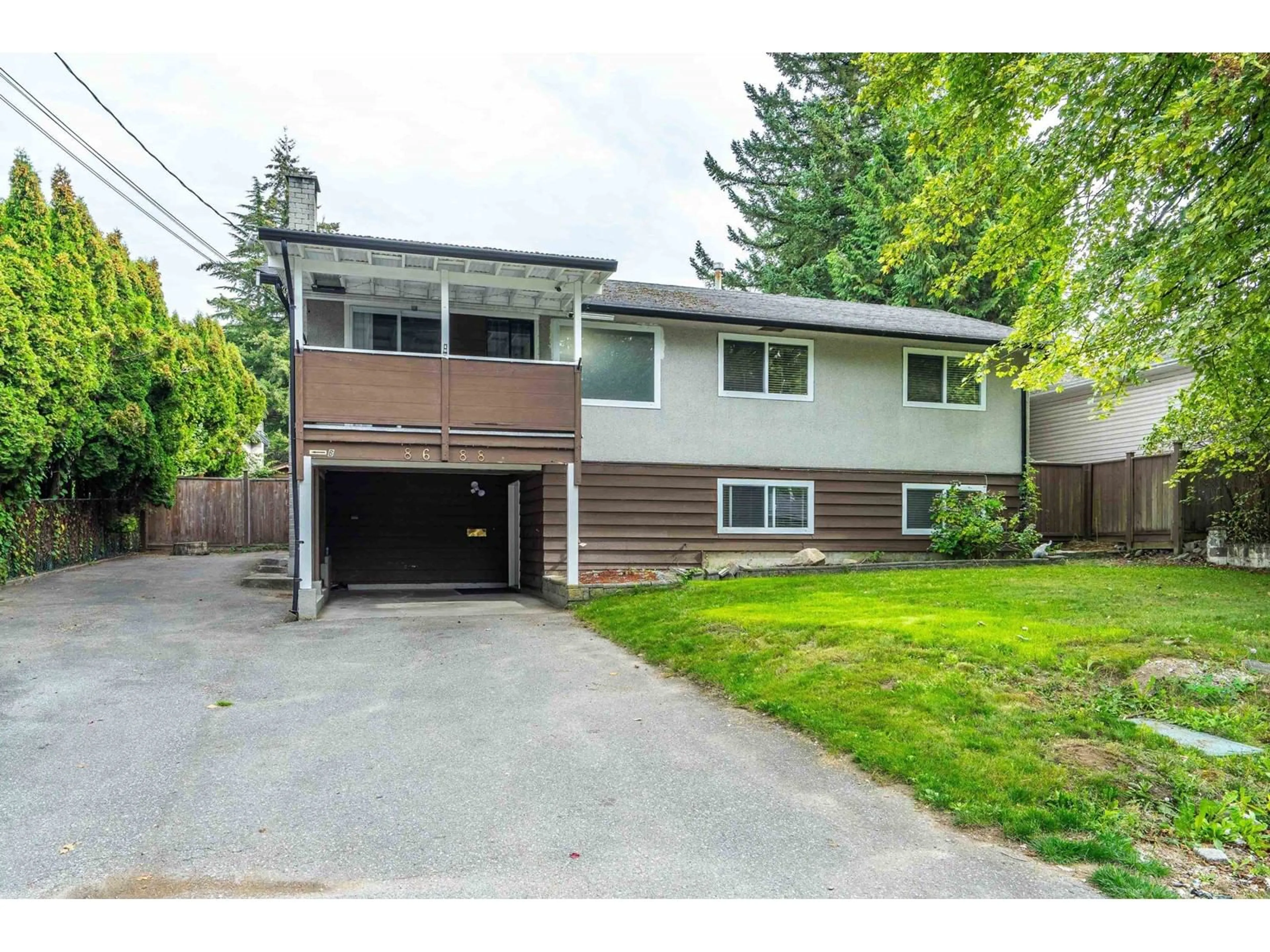 Frontside or backside of a home, the fenced backyard for 8688 110A STREET, Delta British Columbia V4C4K7