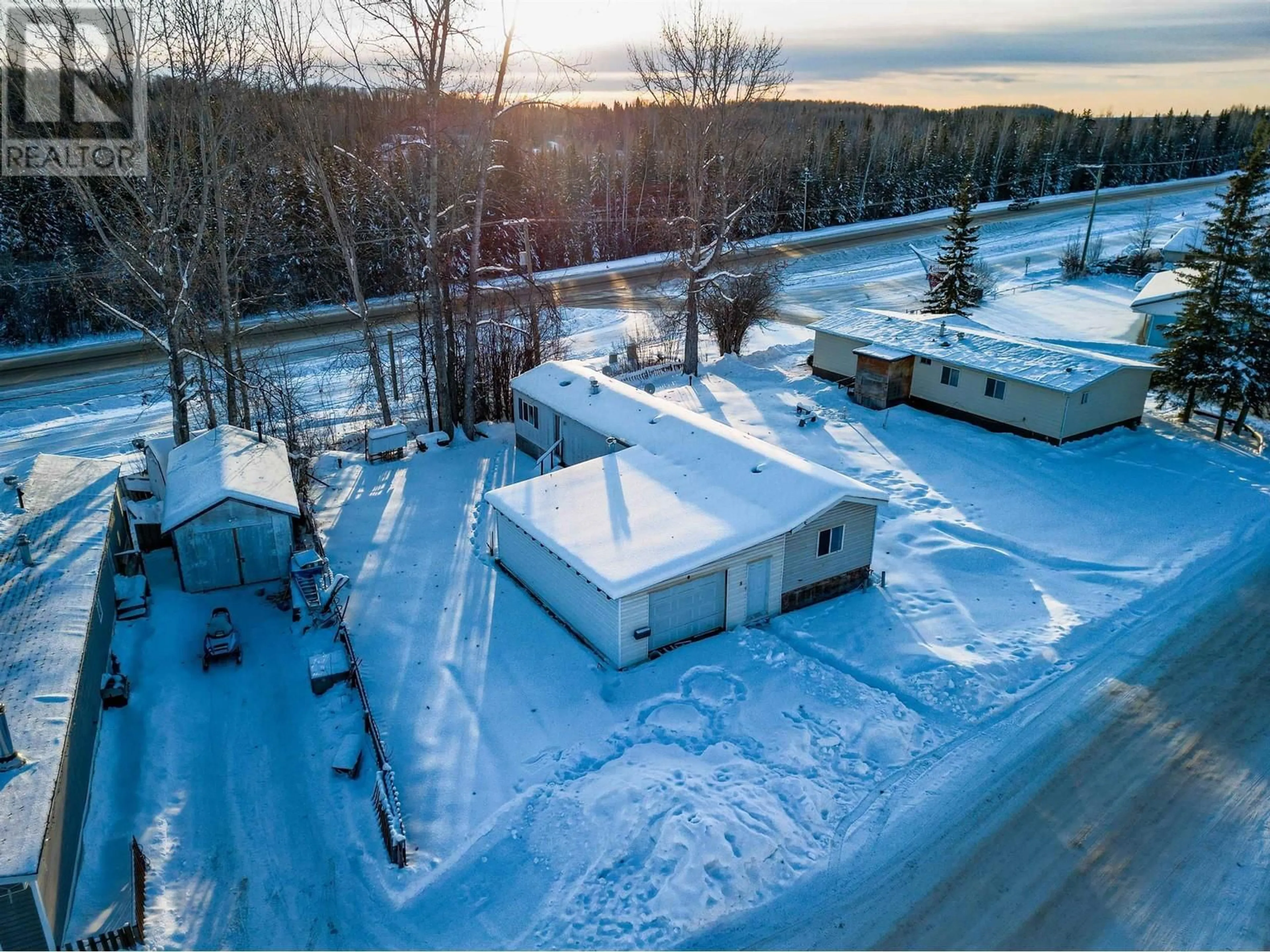 A pic from outside/outdoor area/front of a property/back of a property/a pic from drone, unknown for 8 2963 KLAHANNIE DRIVE, Fort Nelson British Columbia V0C1R0