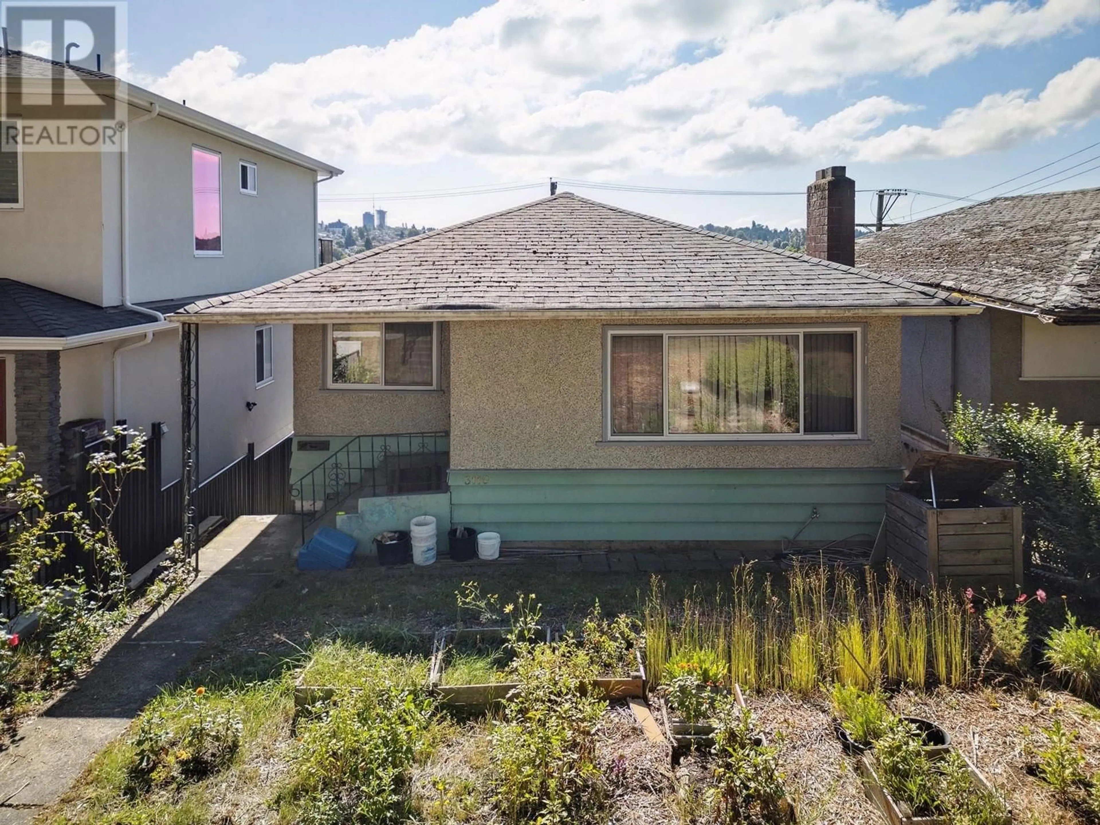 Frontside or backside of a home, the fenced backyard for 3110 E 8TH AVENUE, Vancouver British Columbia V5M1X6