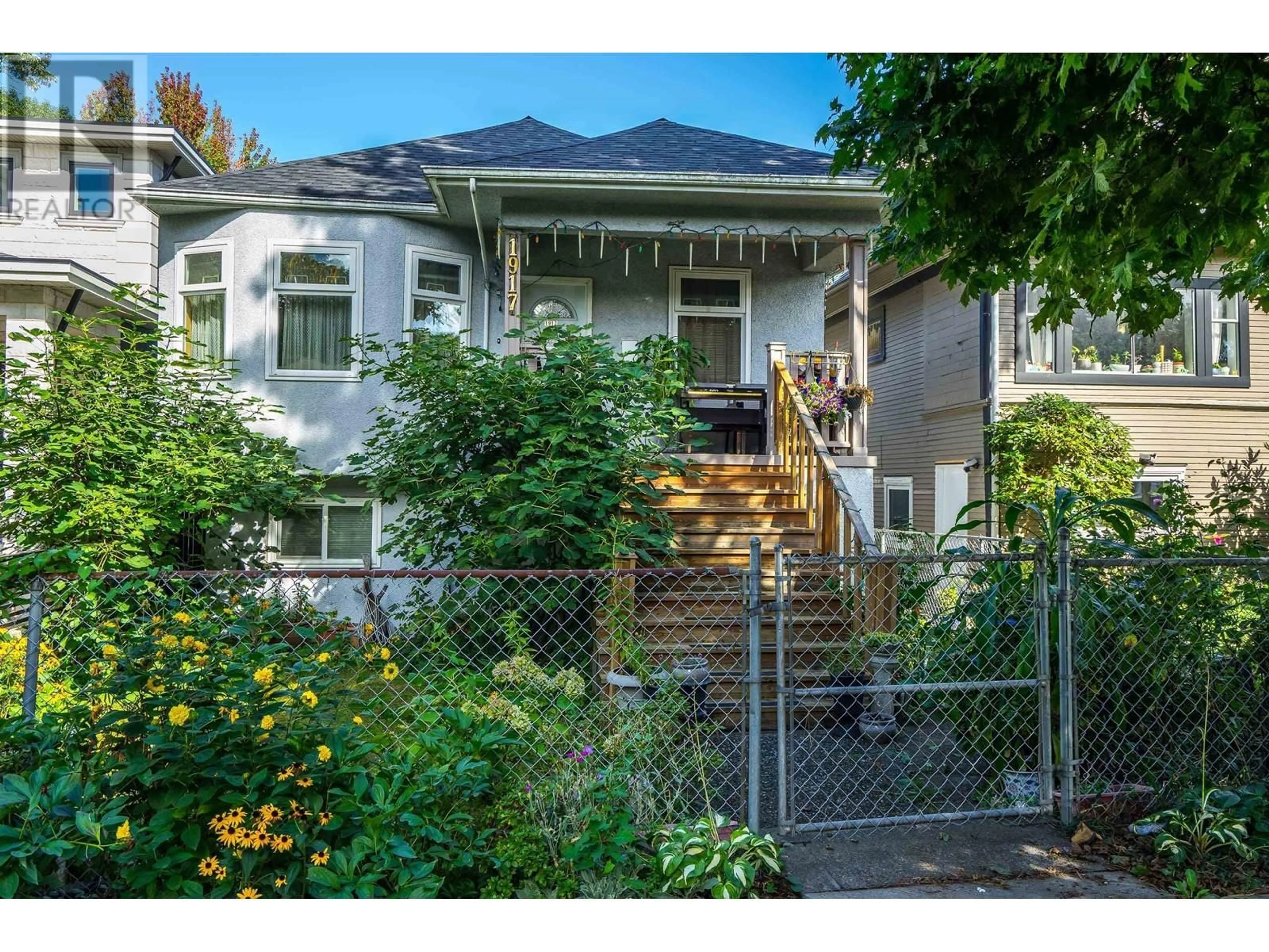 Frontside or backside of a home, the fenced backyard for 1917 E 22 AVENUE, Vancouver British Columbia V5N2R2