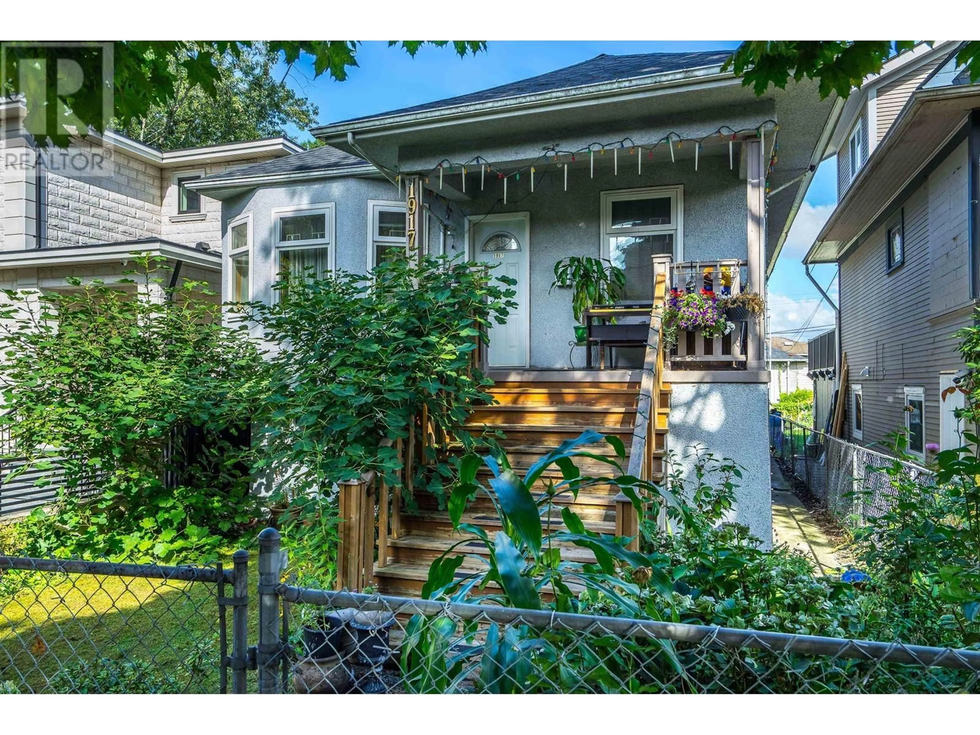 Frontside or backside of a home, the fenced backyard for 1917 E 22 AVENUE, Vancouver British Columbia V5N2R2