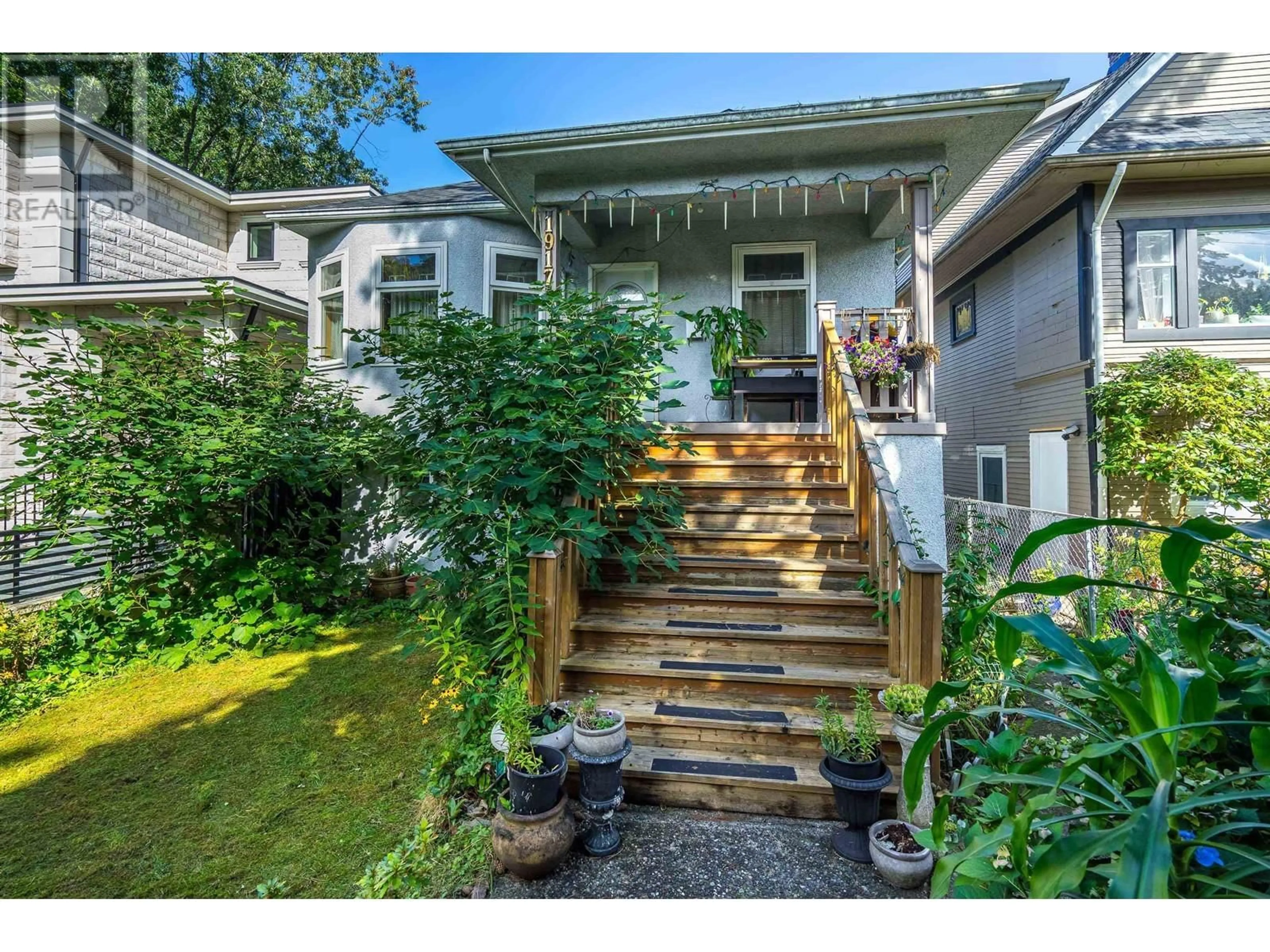 Frontside or backside of a home, the fenced backyard for 1917 E 22 AVENUE, Vancouver British Columbia V5N2R2