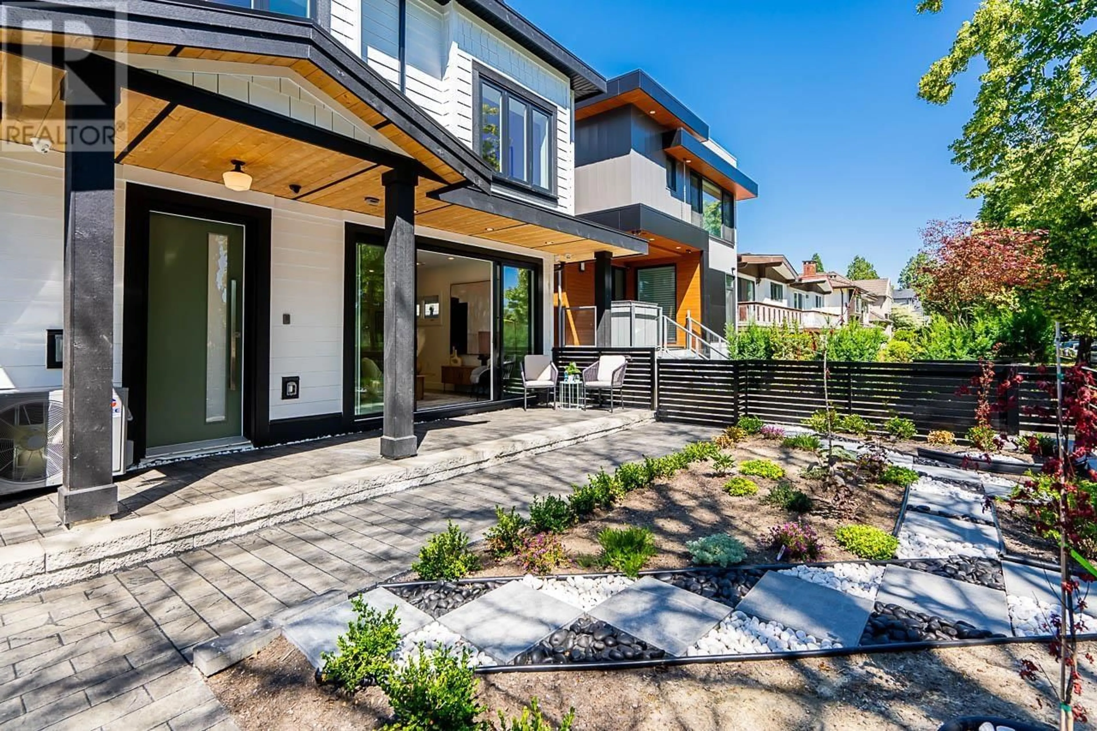 Frontside or backside of a home, the fenced backyard for 1 6273 WINDSOR STREET, Vancouver British Columbia V5W3J2