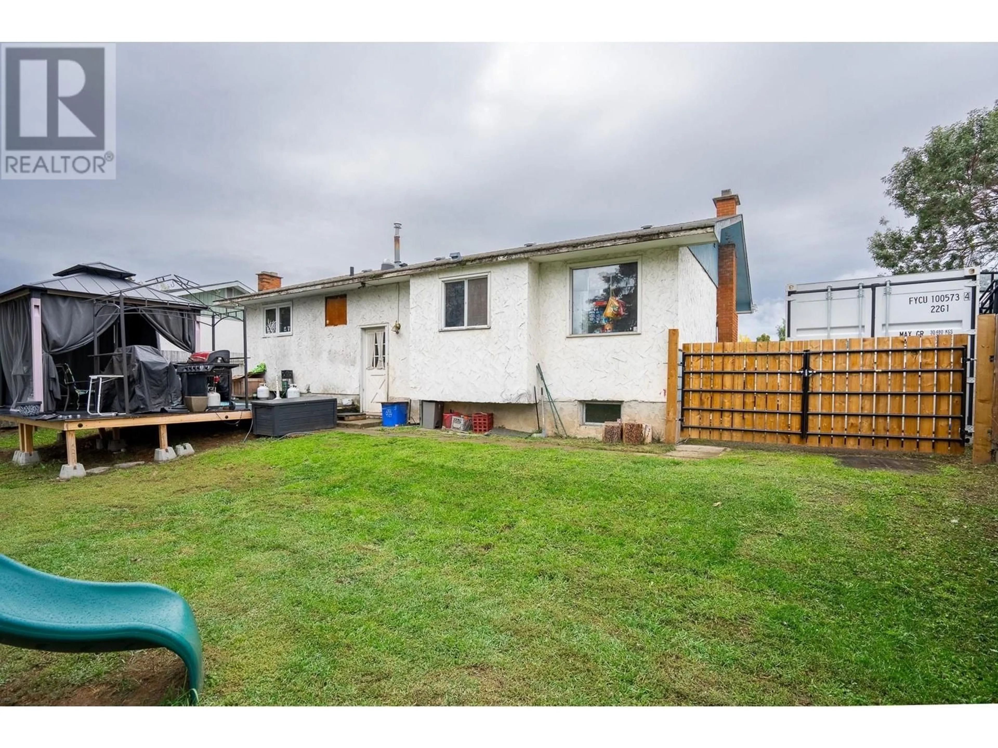 Frontside or backside of a home, the fenced backyard for 4234 DAVIE AVENUE, Prince George British Columbia V2M4G7