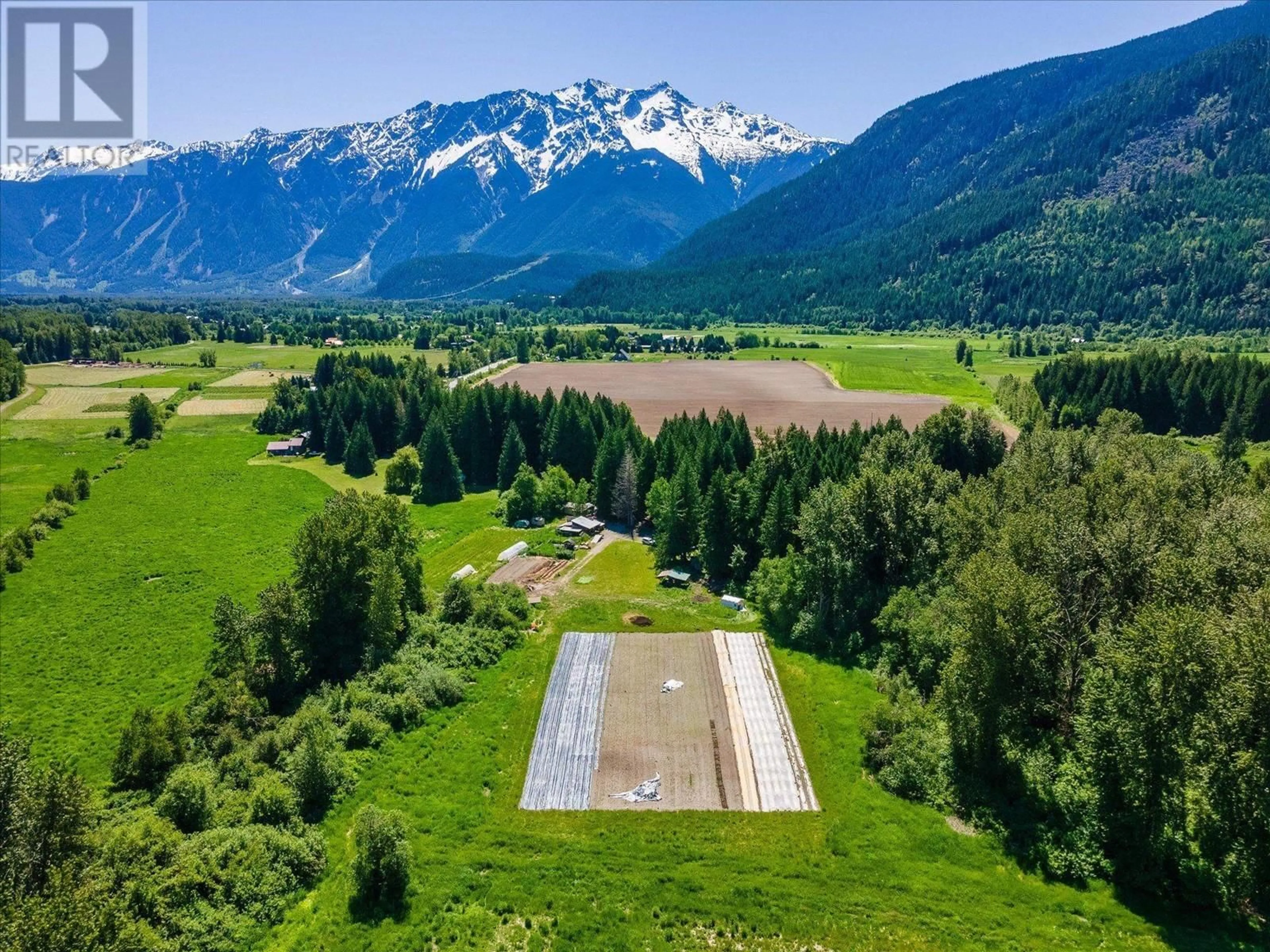 A pic from outside/outdoor area/front of a property/back of a property/a pic from drone, mountain view for 7700 PEMBERTON MEADOWS ROAD, Pemberton British Columbia V0N2L2