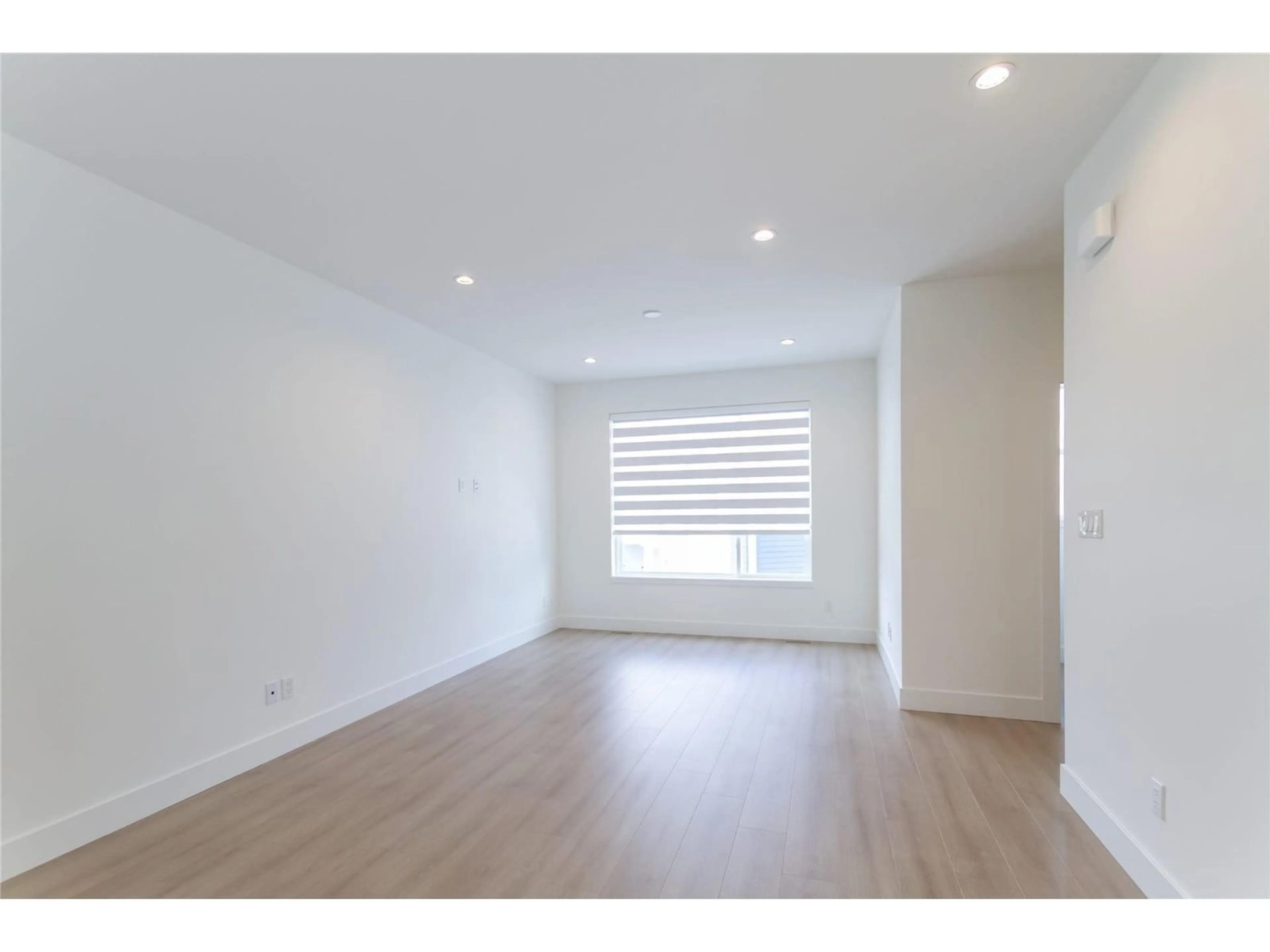 A pic of a room, wood floors for 8 19330 FAIRWAY DRIVE, Langley British Columbia V3S0B7