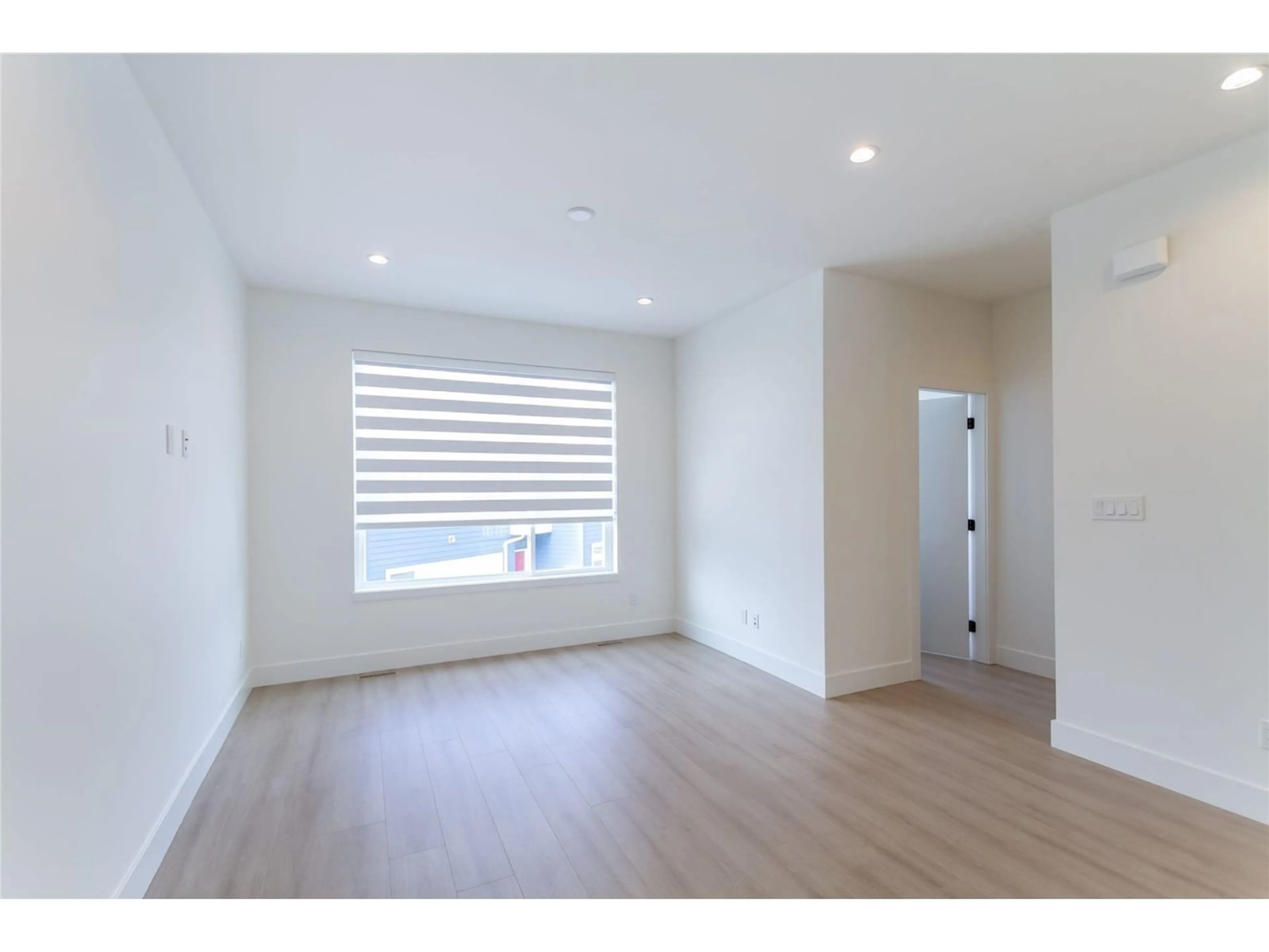 A pic of a room, wood floors for 8 19330 FAIRWAY DRIVE, Langley British Columbia V3S0B7