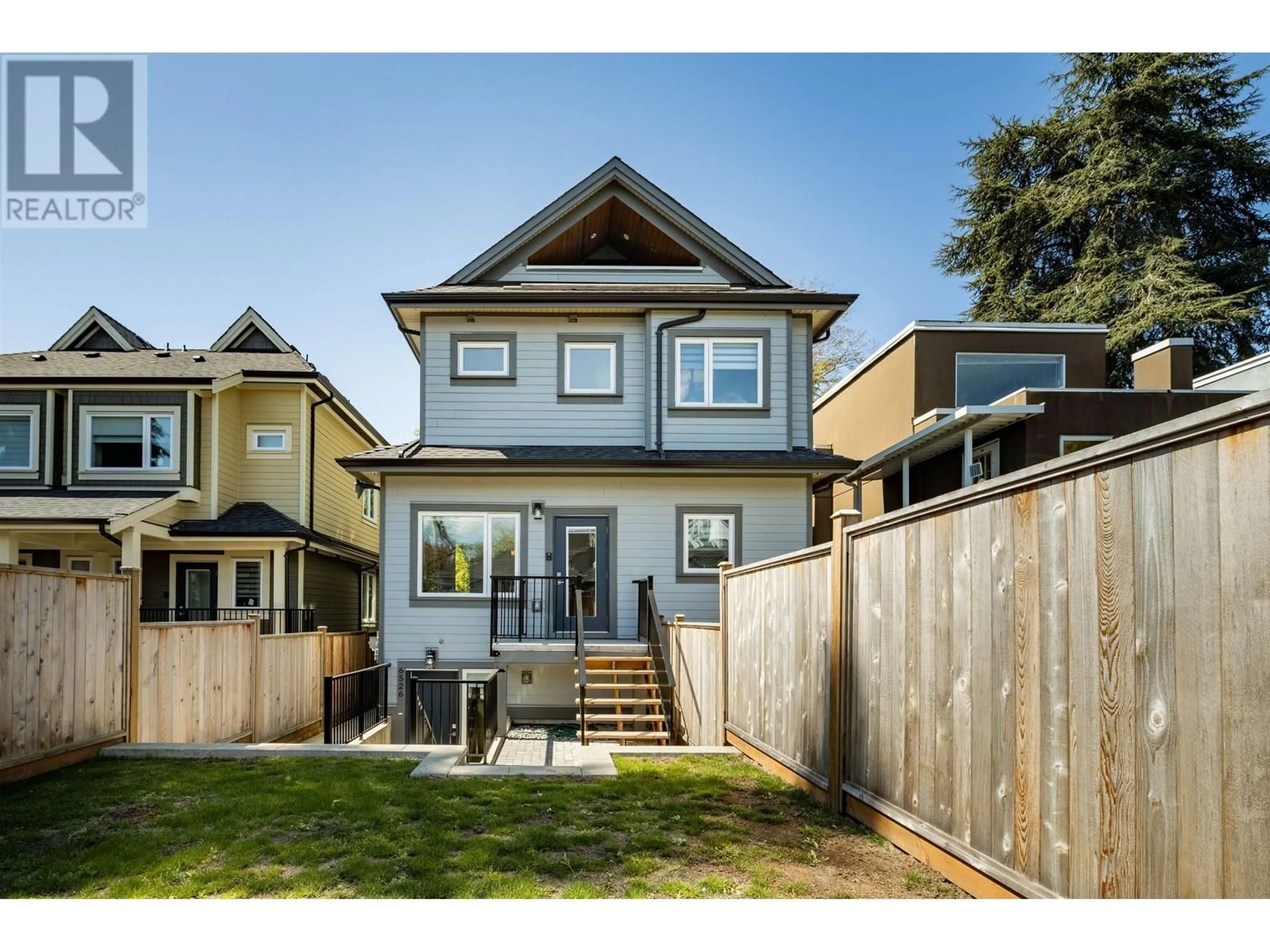 Frontside or backside of a home, the fenced backyard for 6524 ANGUS DRIVE, Vancouver British Columbia V6P5H9