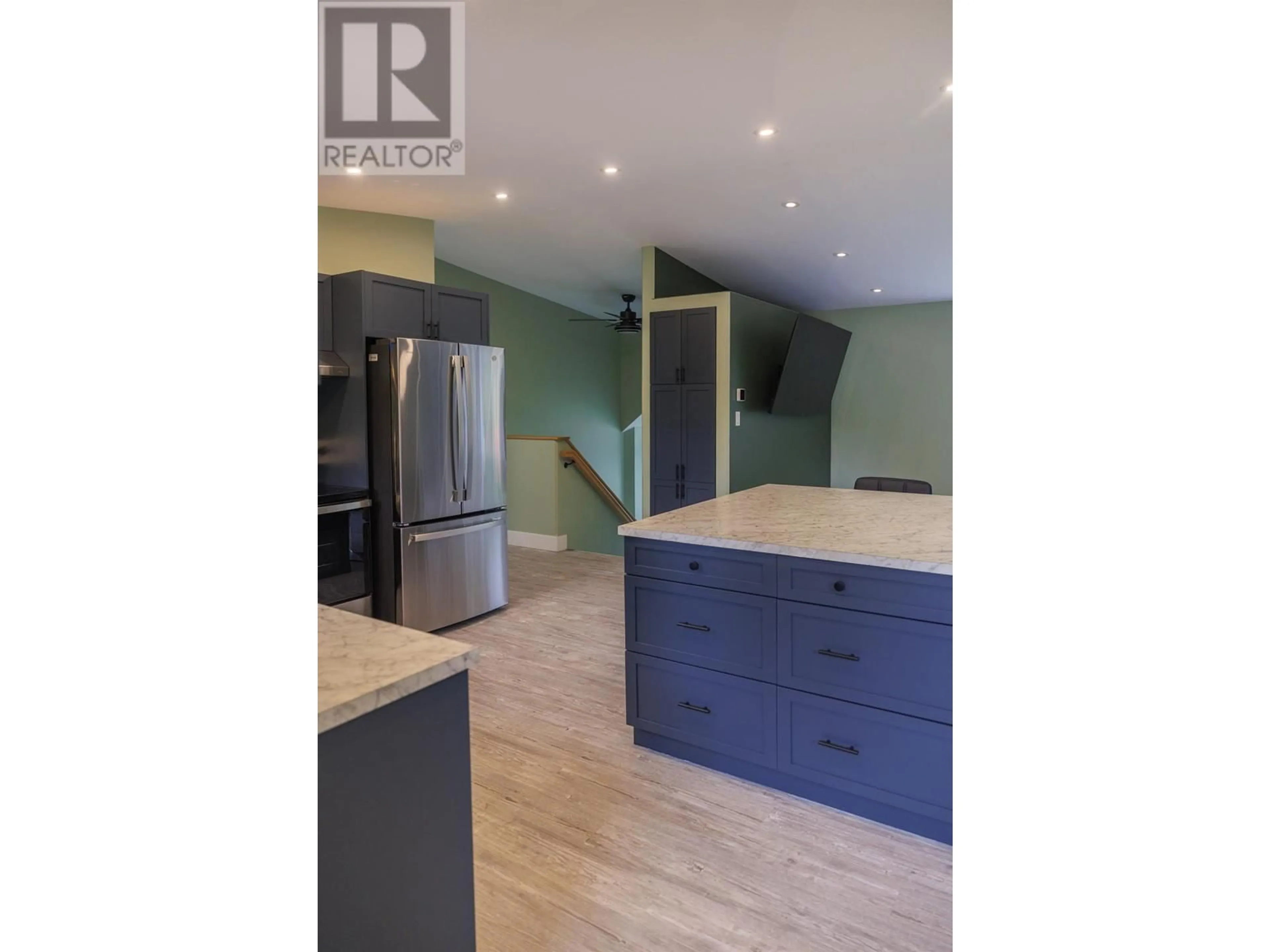 Open concept kitchen, wood/laminate floor for 892 DOMINION STREET, McBride British Columbia V0J2E0