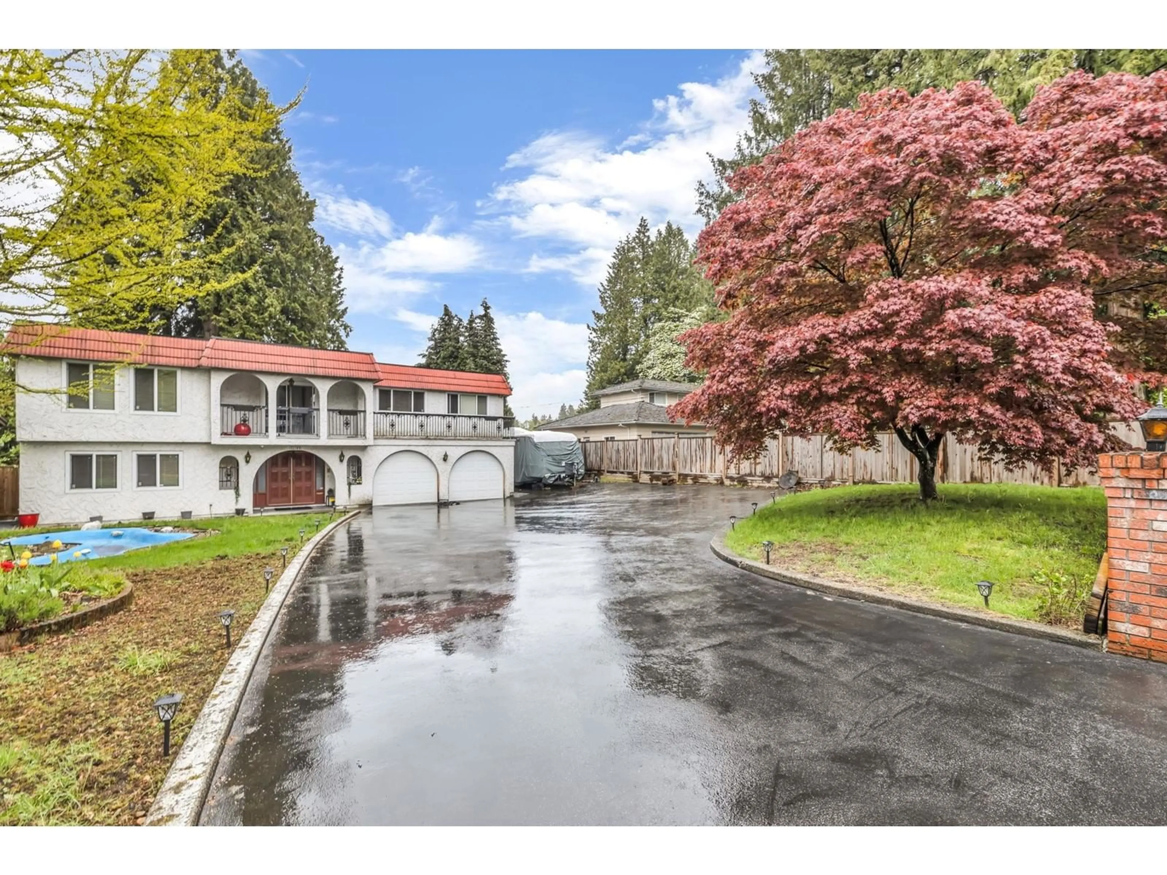 A pic from exterior of the house or condo, the fenced backyard for 11199 92A AVENUE, Delta British Columbia V4C3L9