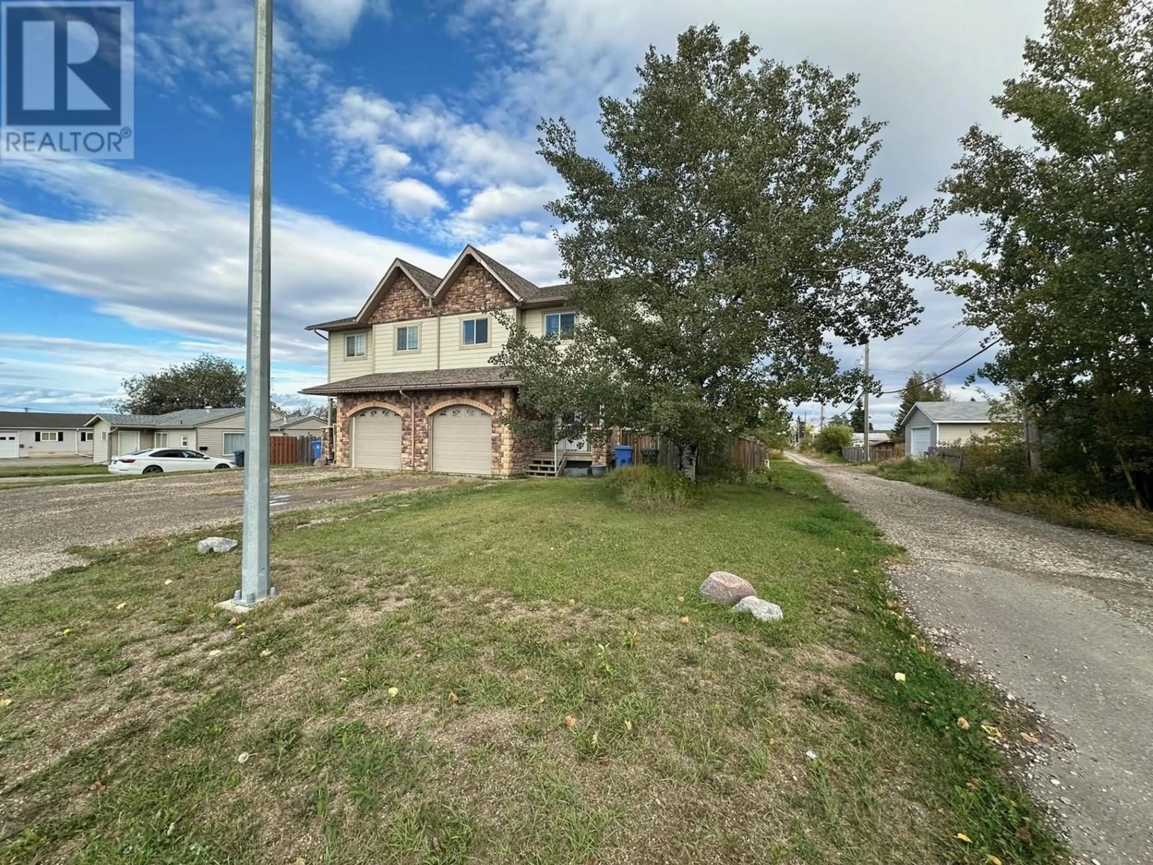 Frontside or backside of a home for 9711 86 STREET, Fort St. John British Columbia V1J3G3