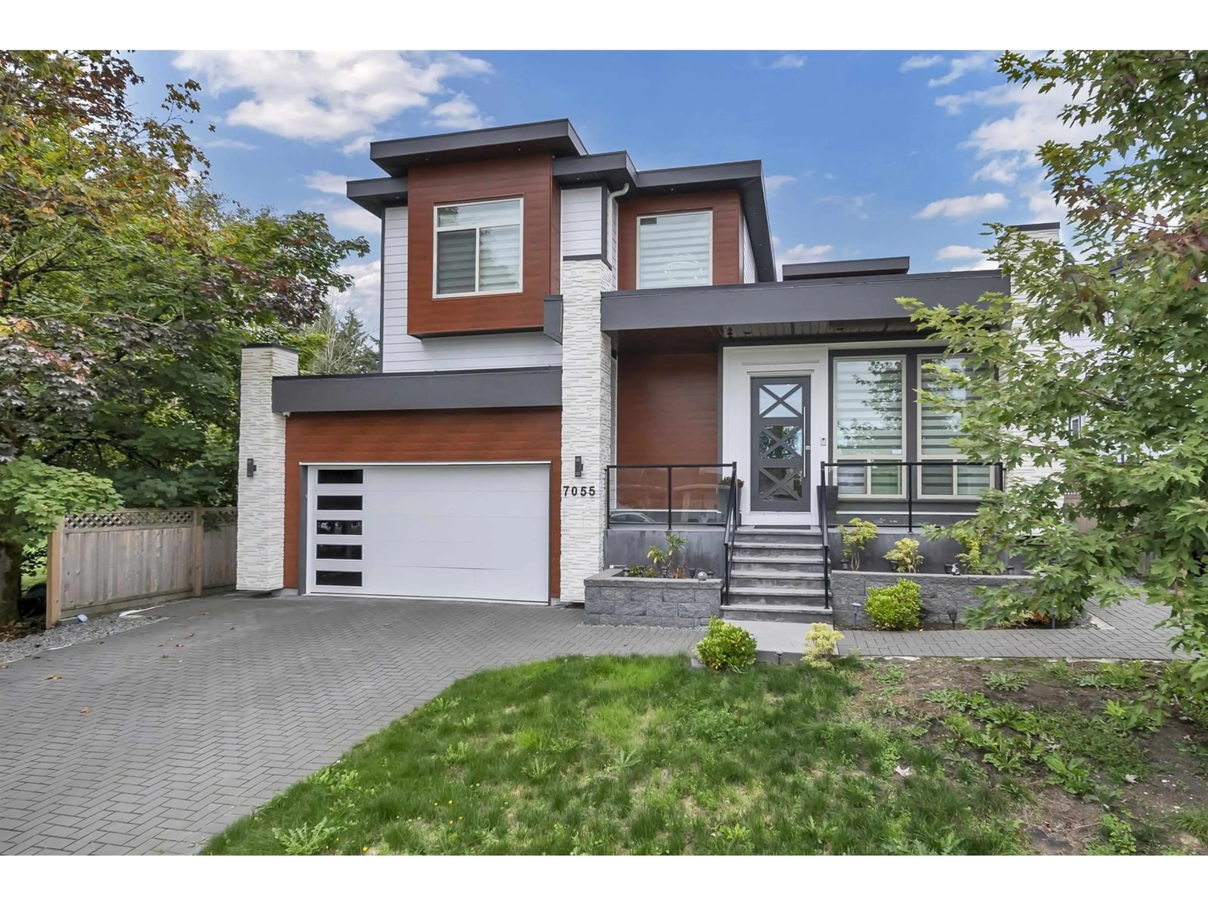 Frontside or backside of a home, the street view for 7055 193 STREET, Surrey British Columbia V4N1N2