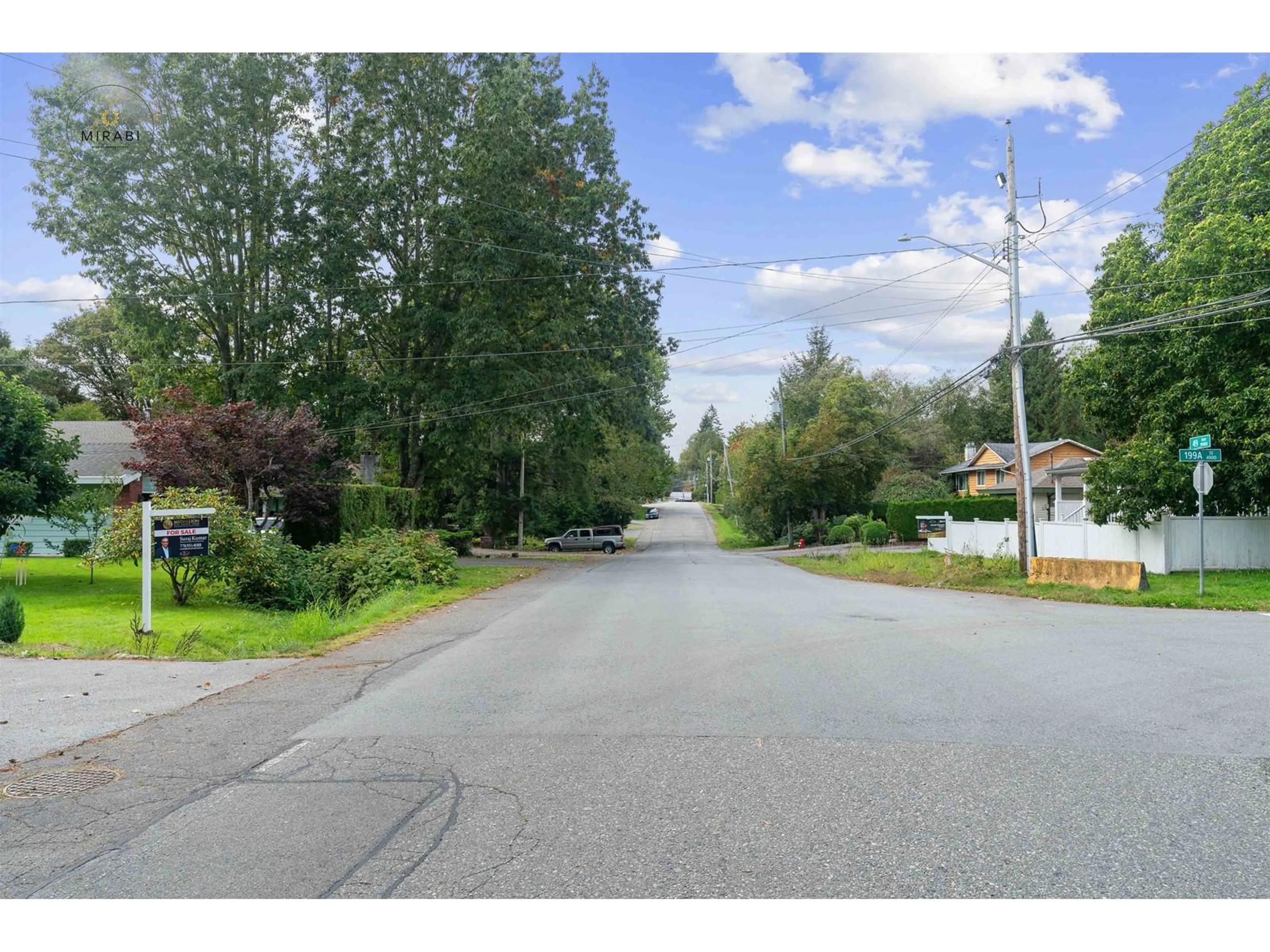 Frontside or backside of a home, the street view for 19976 49 AVENUE, Langley British Columbia V3A3R6