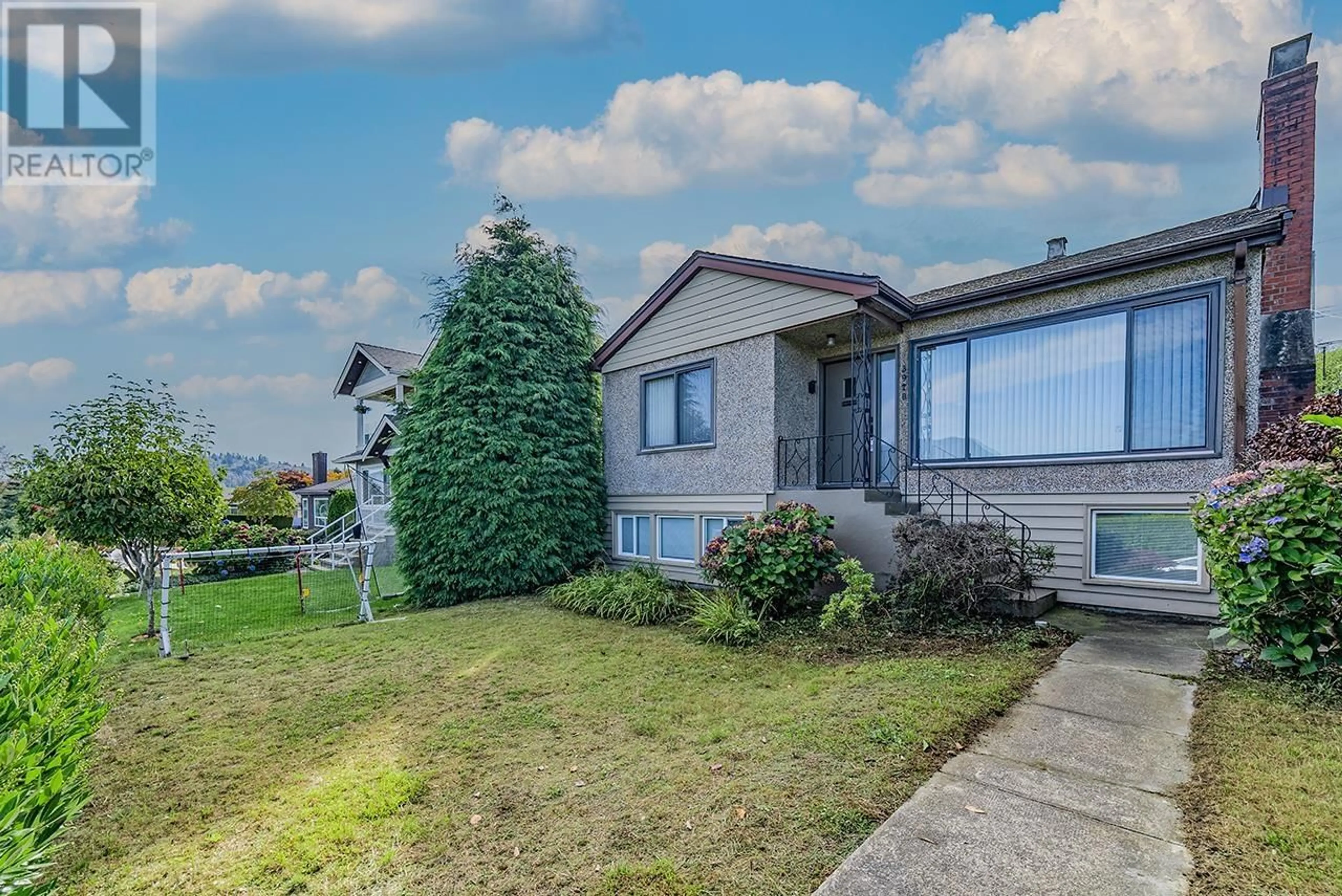 Frontside or backside of a home, the fenced backyard for 3970 EDINBURGH STREET, Burnaby British Columbia V5C1R7