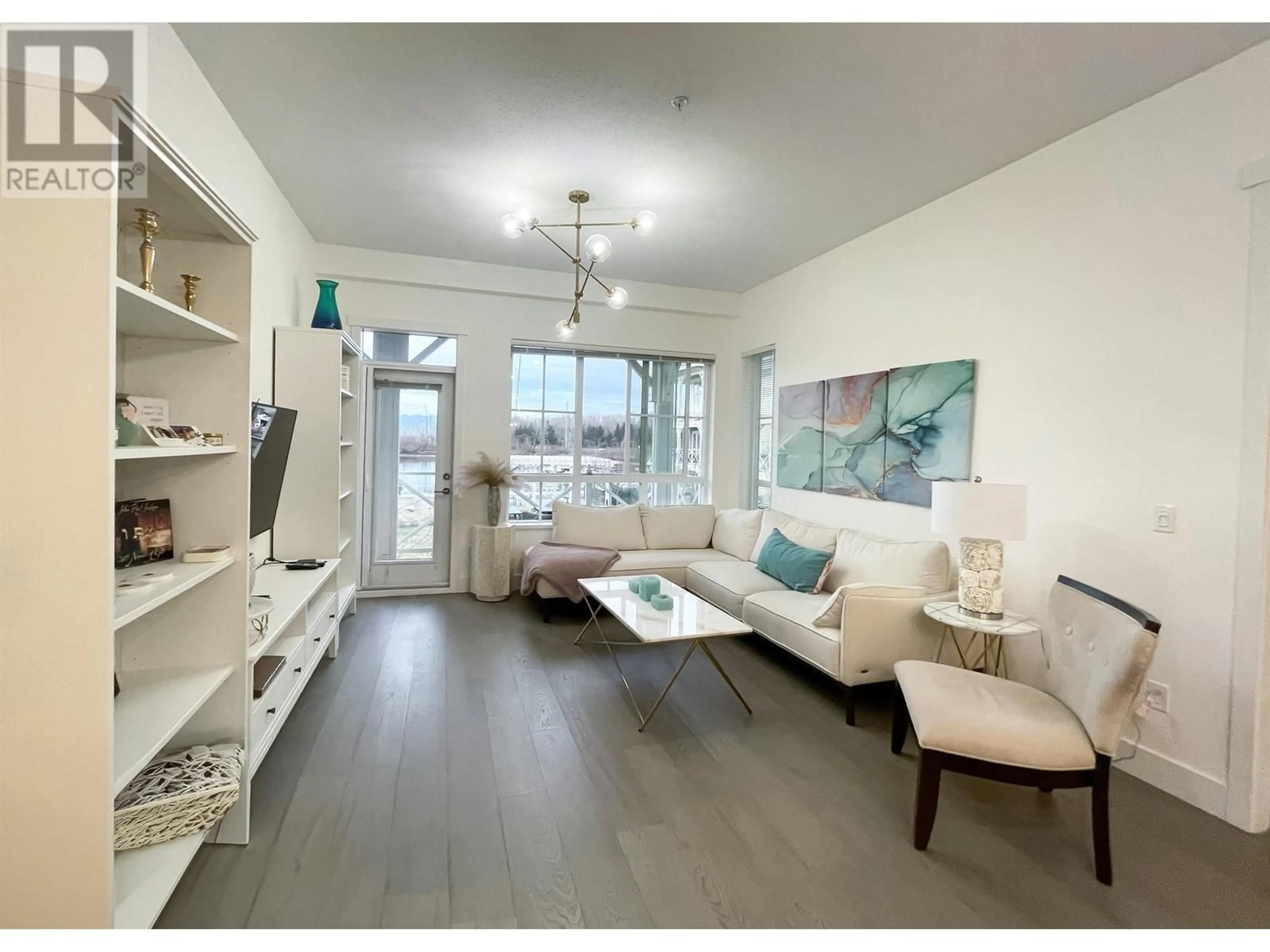 Living room, wood floors for 213 5535 ADMIRAL WAY, Delta British Columbia V4K0E3