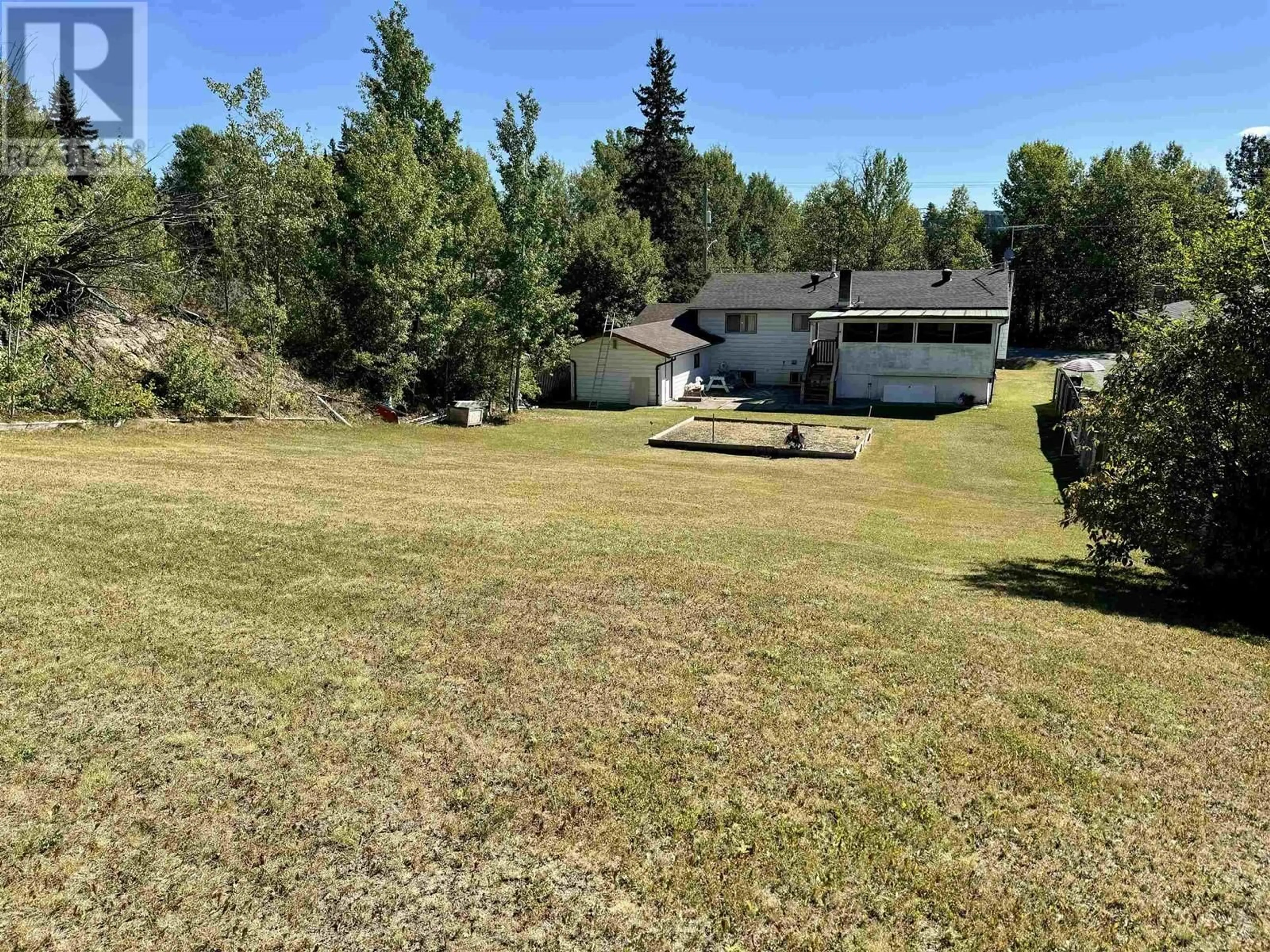 Frontside or backside of a home, the fenced backyard for 530 ASH STREET, Fort St. James British Columbia V0J1P0