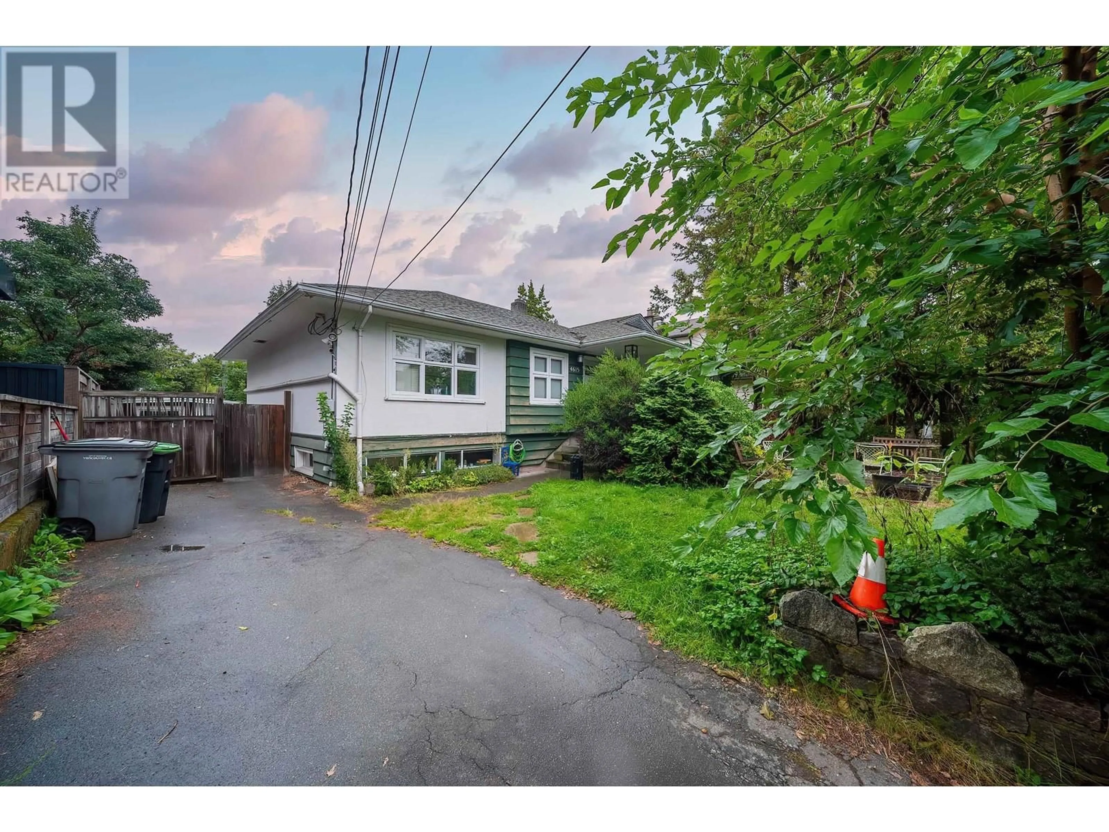 Frontside or backside of a home, the fenced backyard for 4615 W 4TH AVENUE, Vancouver British Columbia V6R1R6