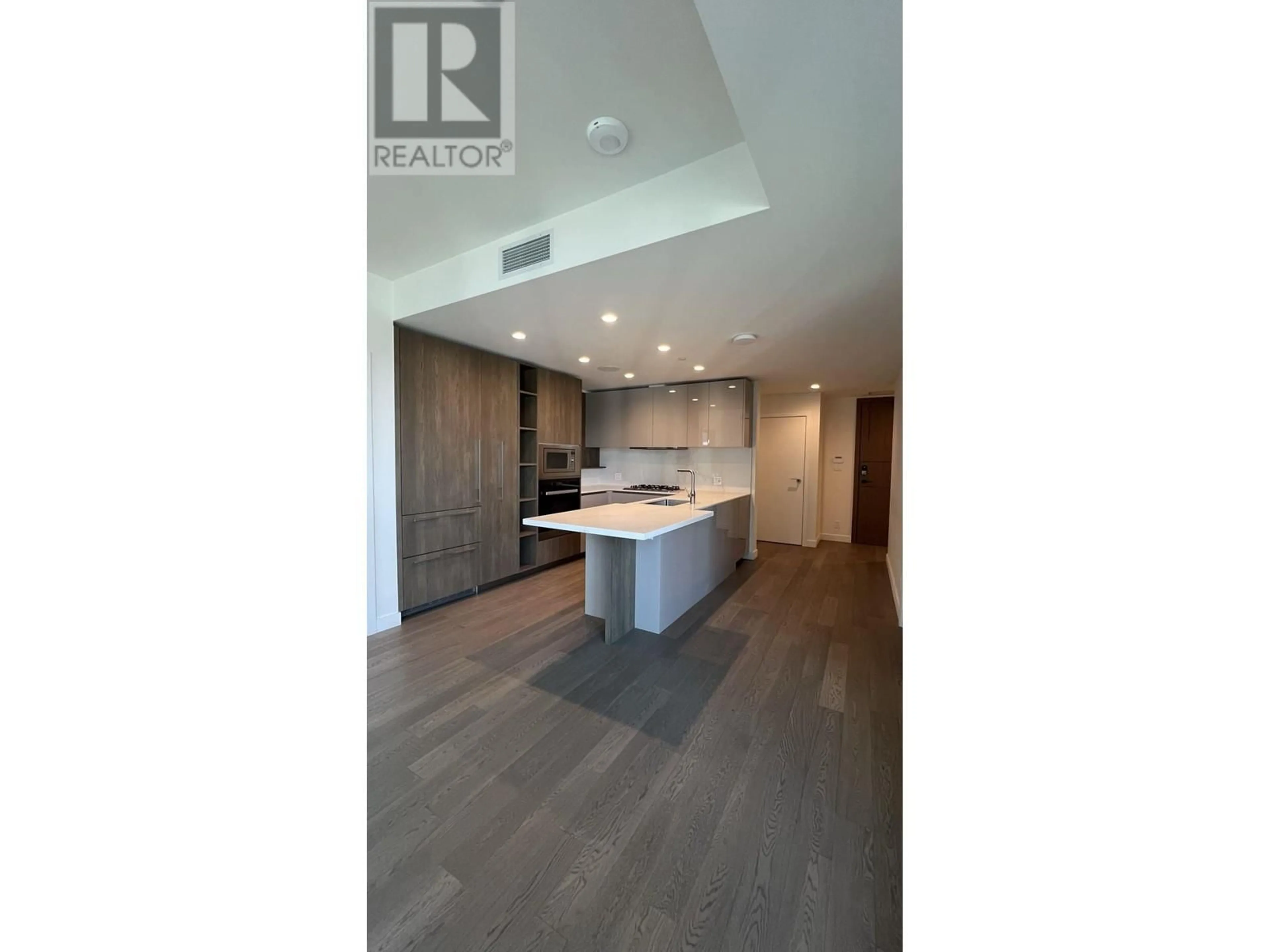 Open concept kitchen, wood/laminate floor for 608 - 6811 PEARSON WAY, Richmond British Columbia V7C0E7