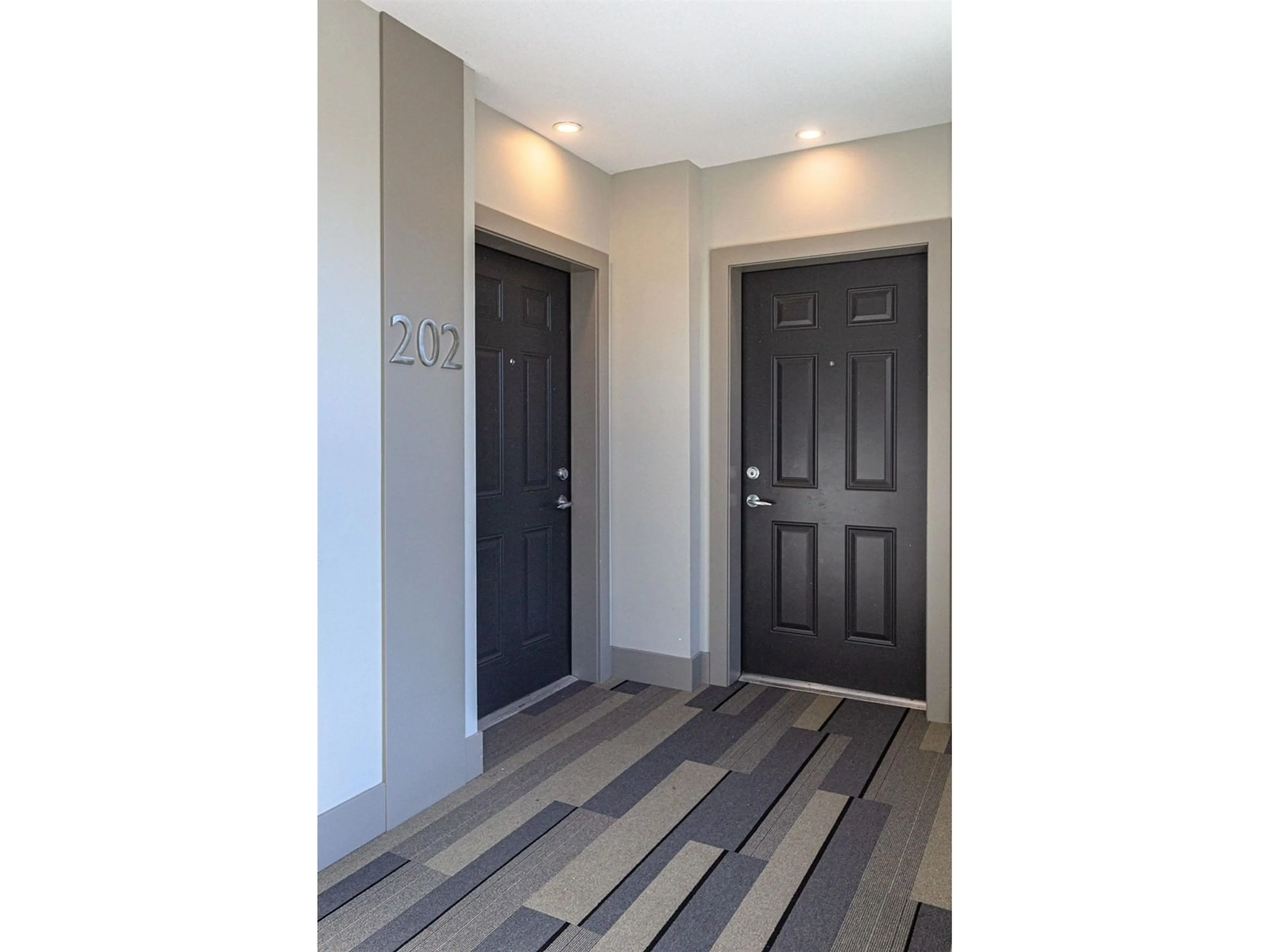 Indoor entryway, wood floors for 202 20826 72 AVENUE, Langley British Columbia V2Y0Z9